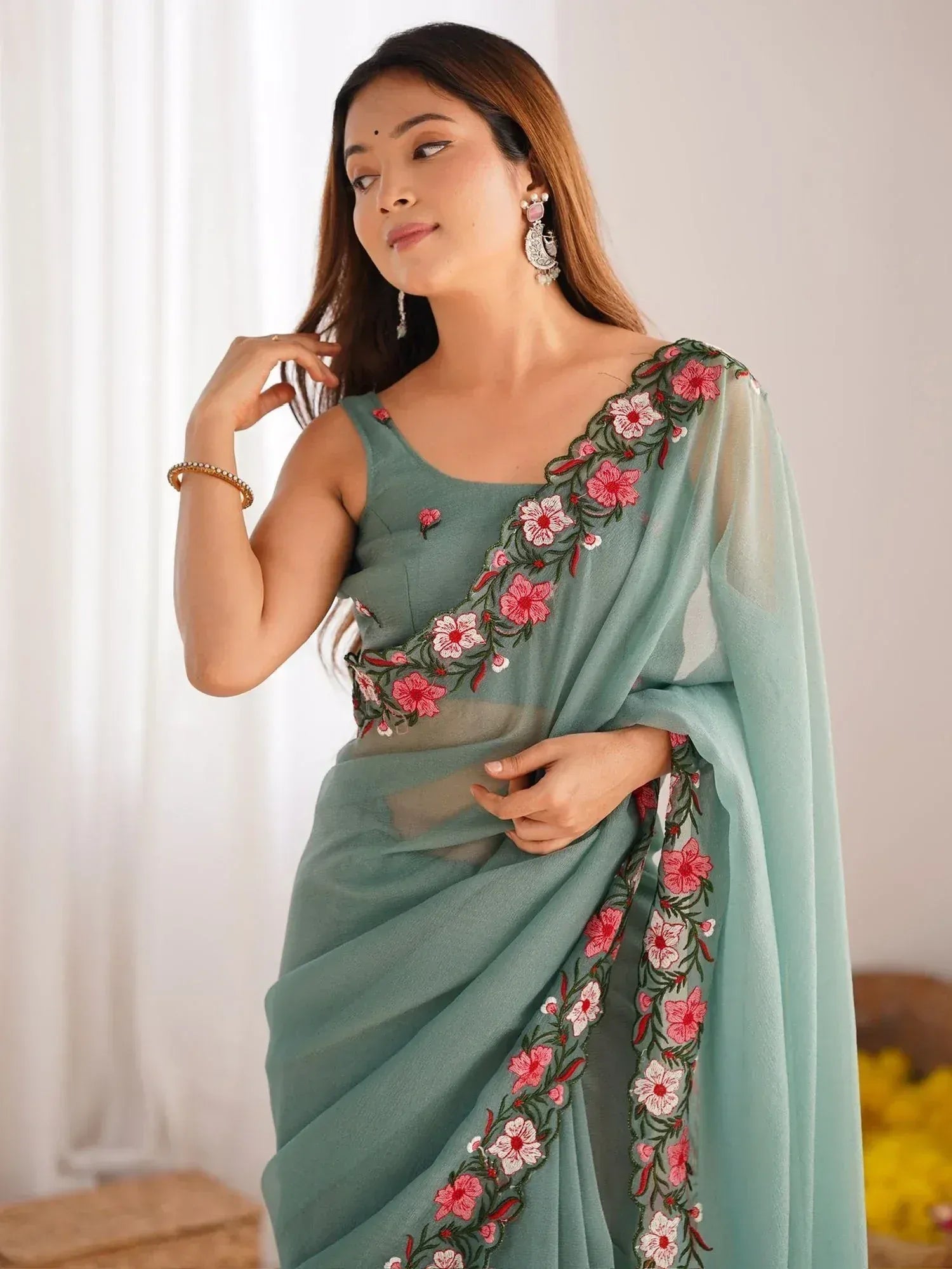 Mint green saree with pink floral embroidery, perfect for Indian ethnic wear occasions