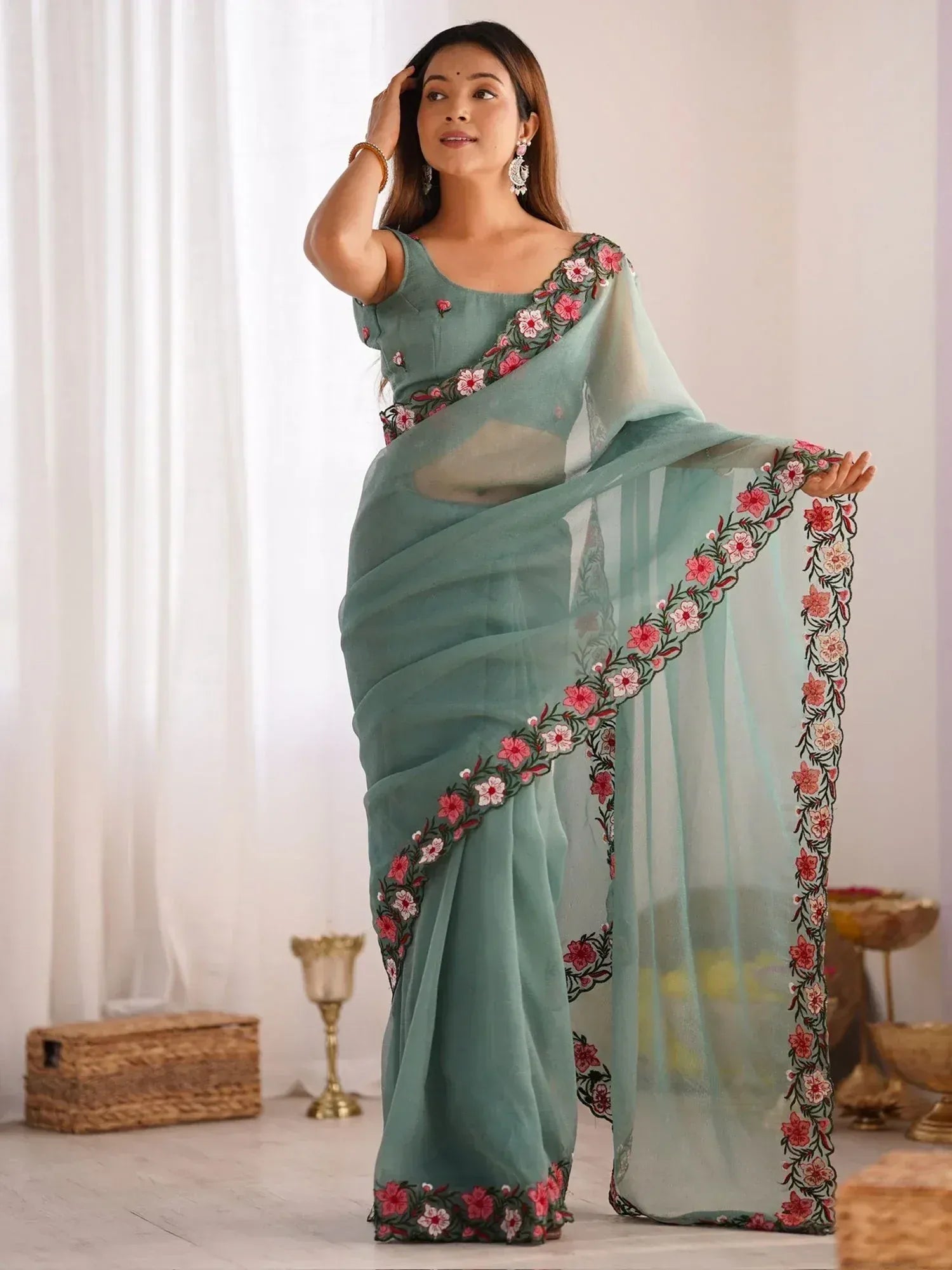 Mint green saree with pink floral embroidery, perfect for Indian ethnic occasions and festive wear.