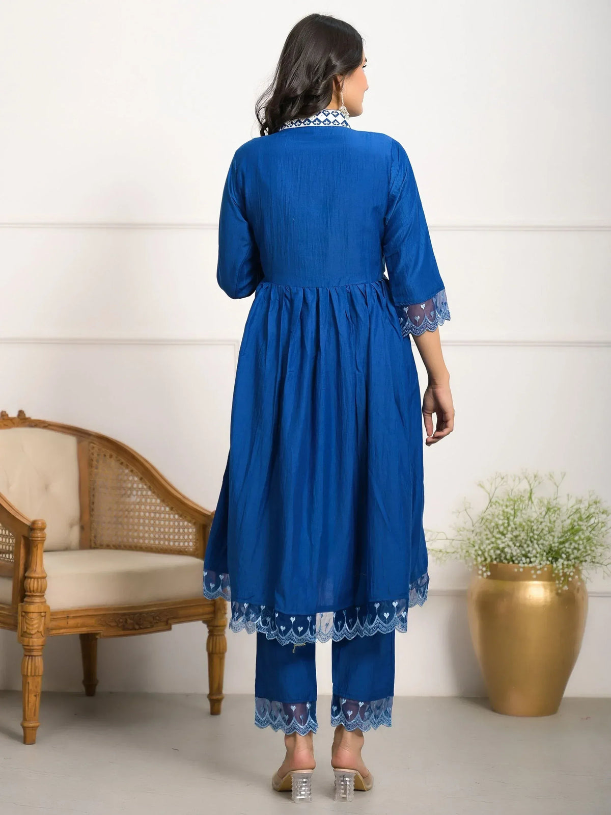Blue ethnic kurta with lace detailing, paired with matching pants, showcasing traditional Indian wear style.