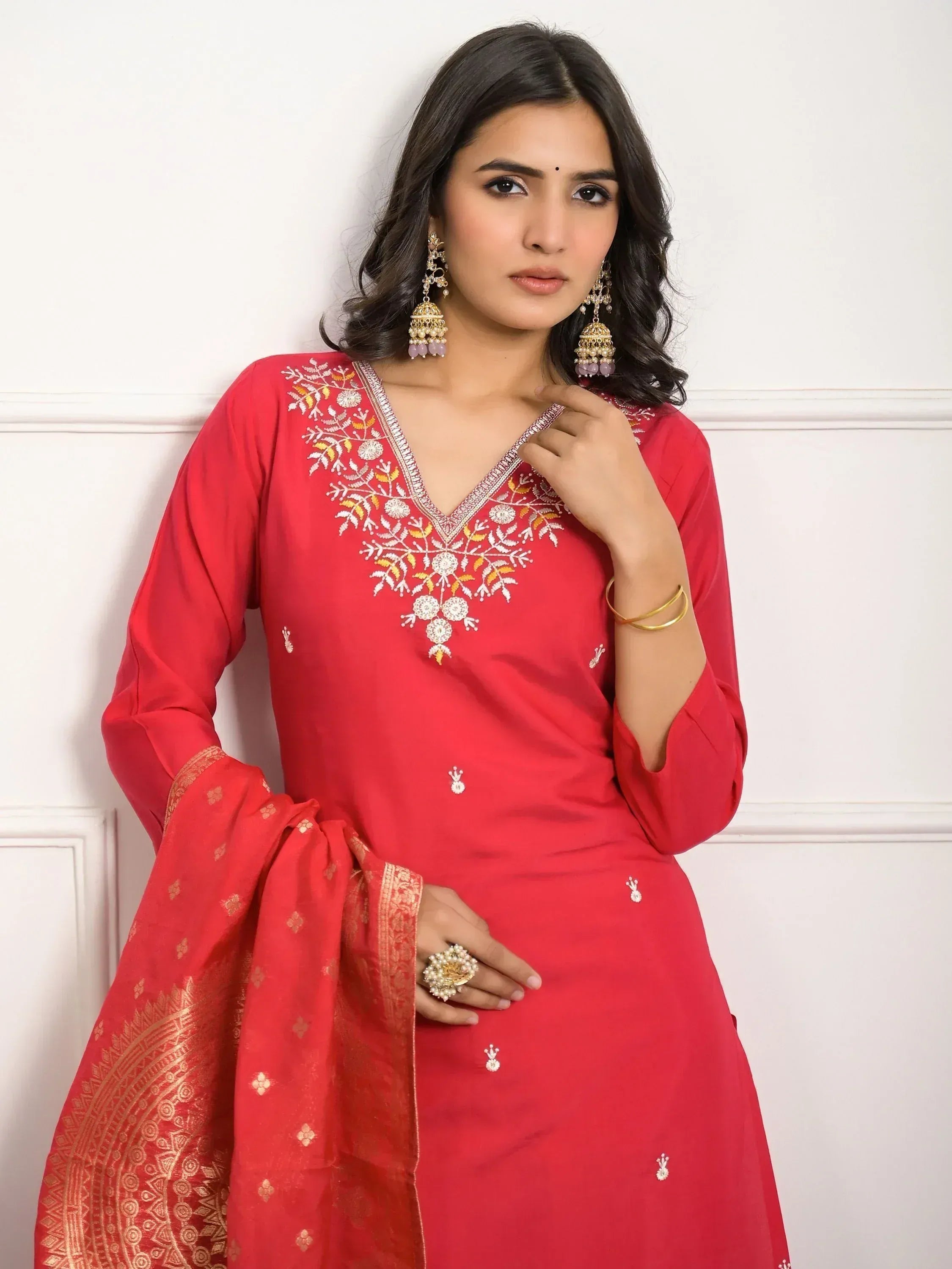 Red embroidered salwar kameez with gold detailing, perfect for Indian ethnic wear occasions