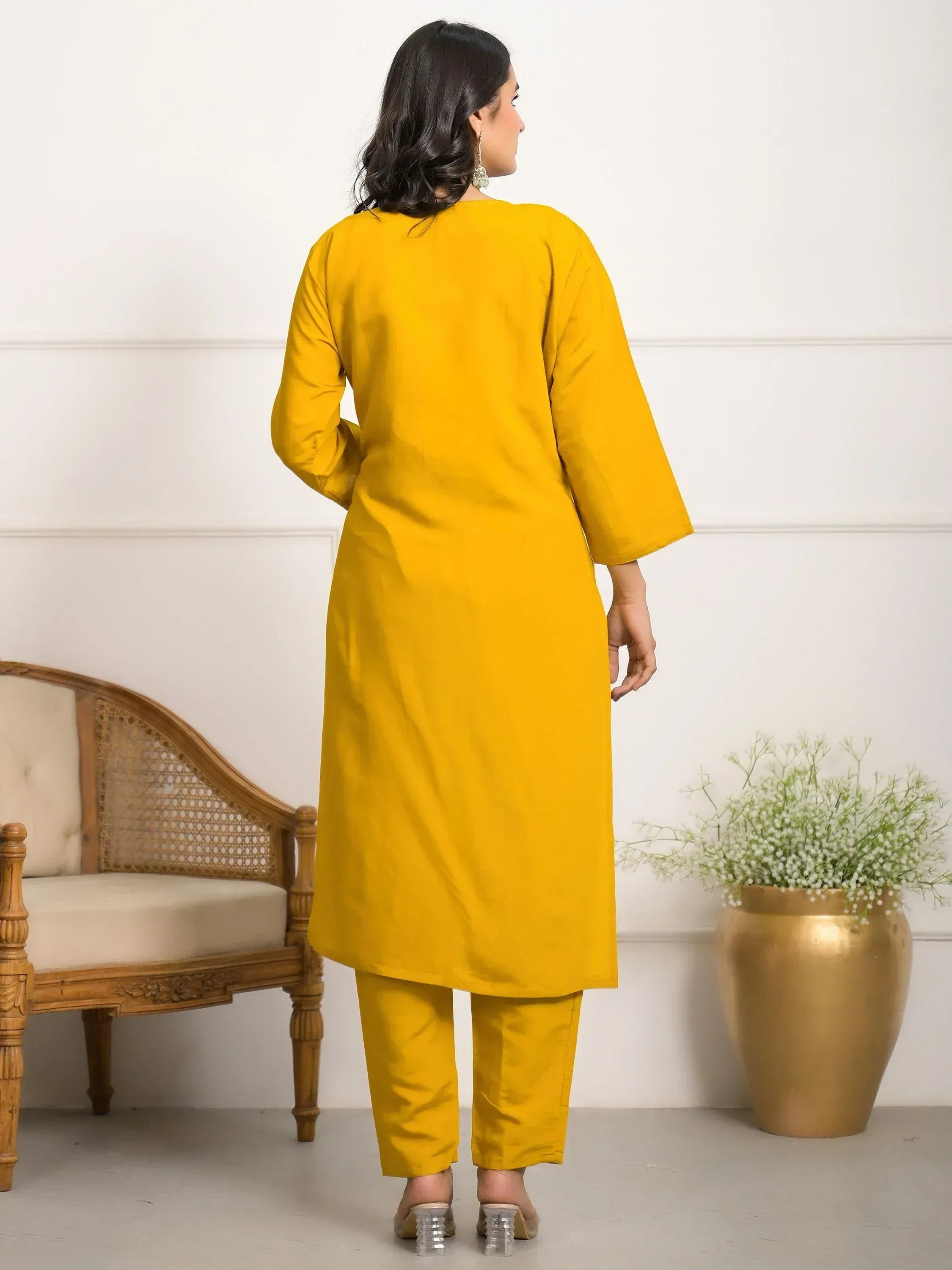 Yellow ethnic kurta set with matching pants, stylish Indian wear for women