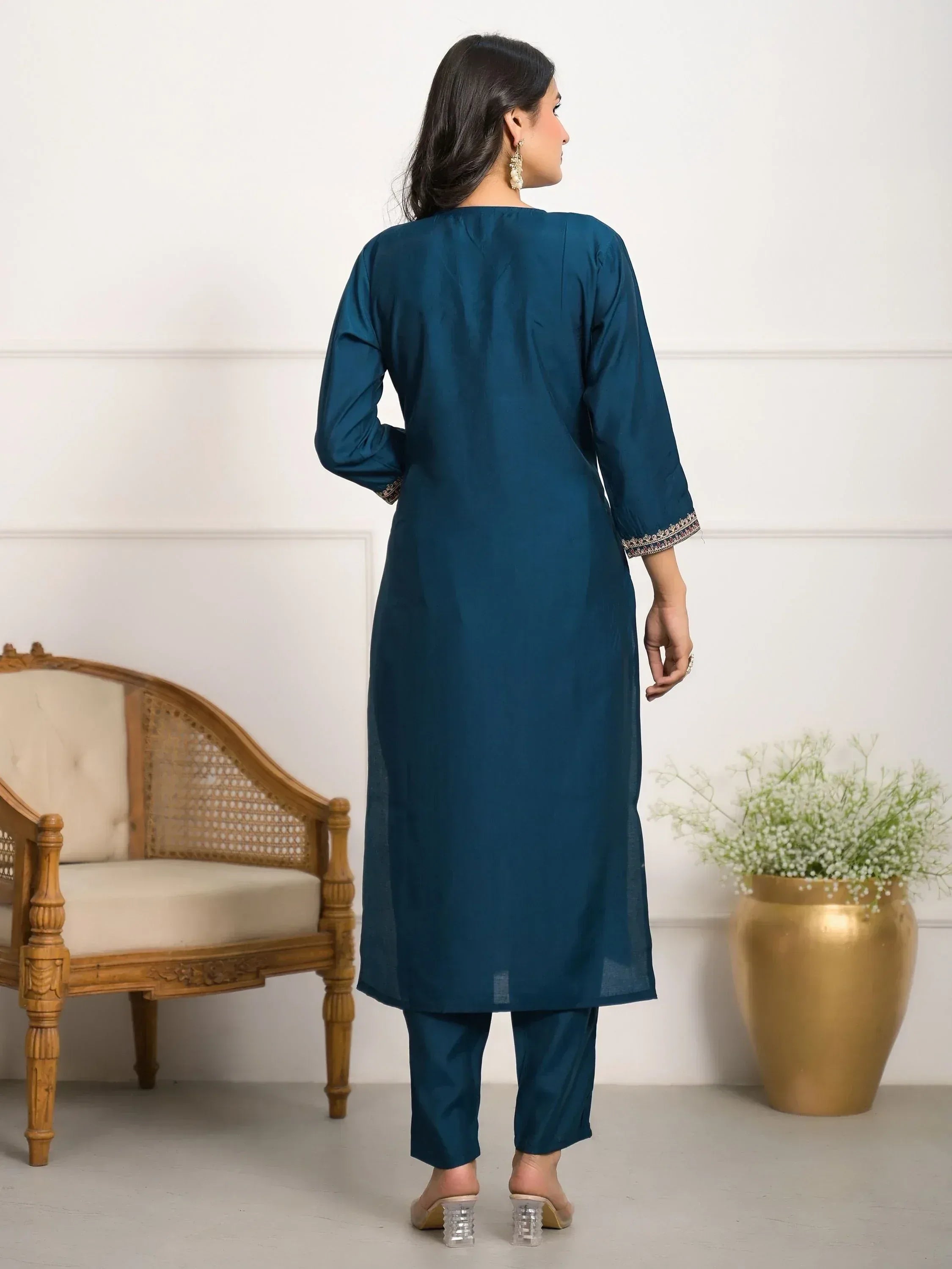 Teal ethnic kurta with embroidered cuffs, paired with matching pants, perfect for Indian festive occasions.