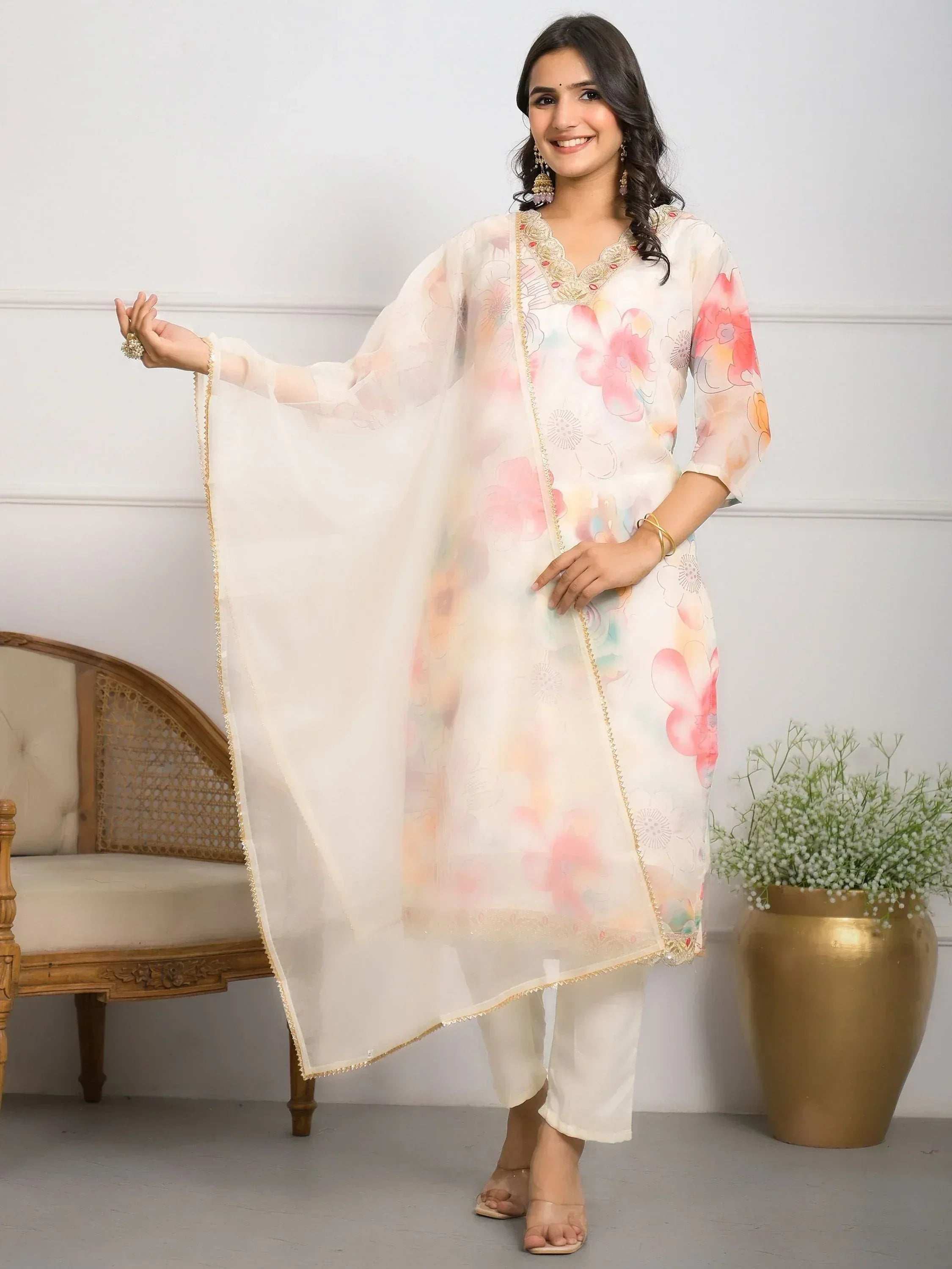Floral printed ethnic salwar kameez with gold trim, perfect for Indian wear and festive occasions.
