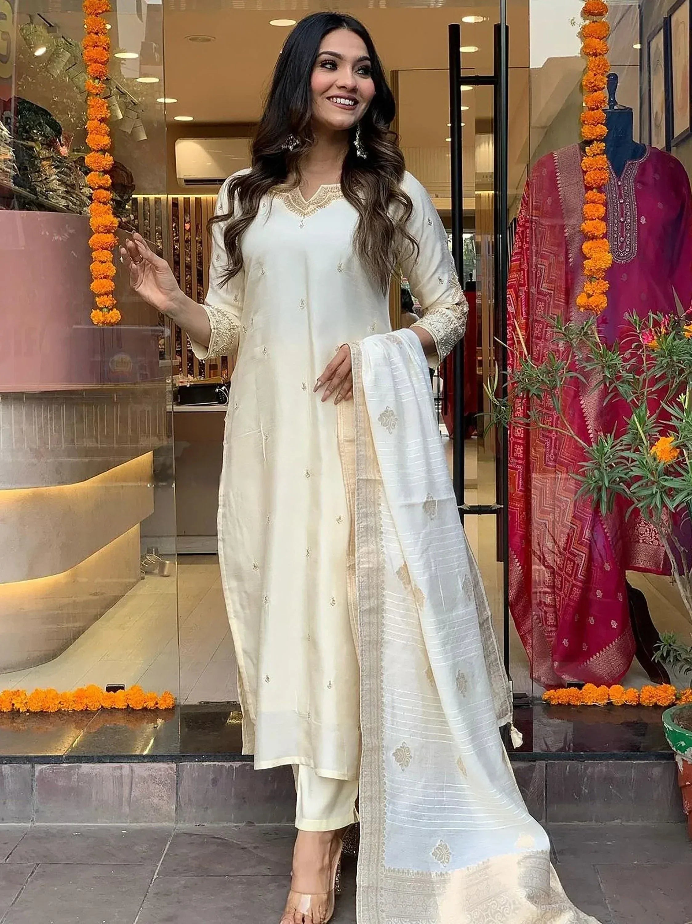 Elegant ivory salwar kameez with gold embroidery, perfect for Indian ethnic wear occasions