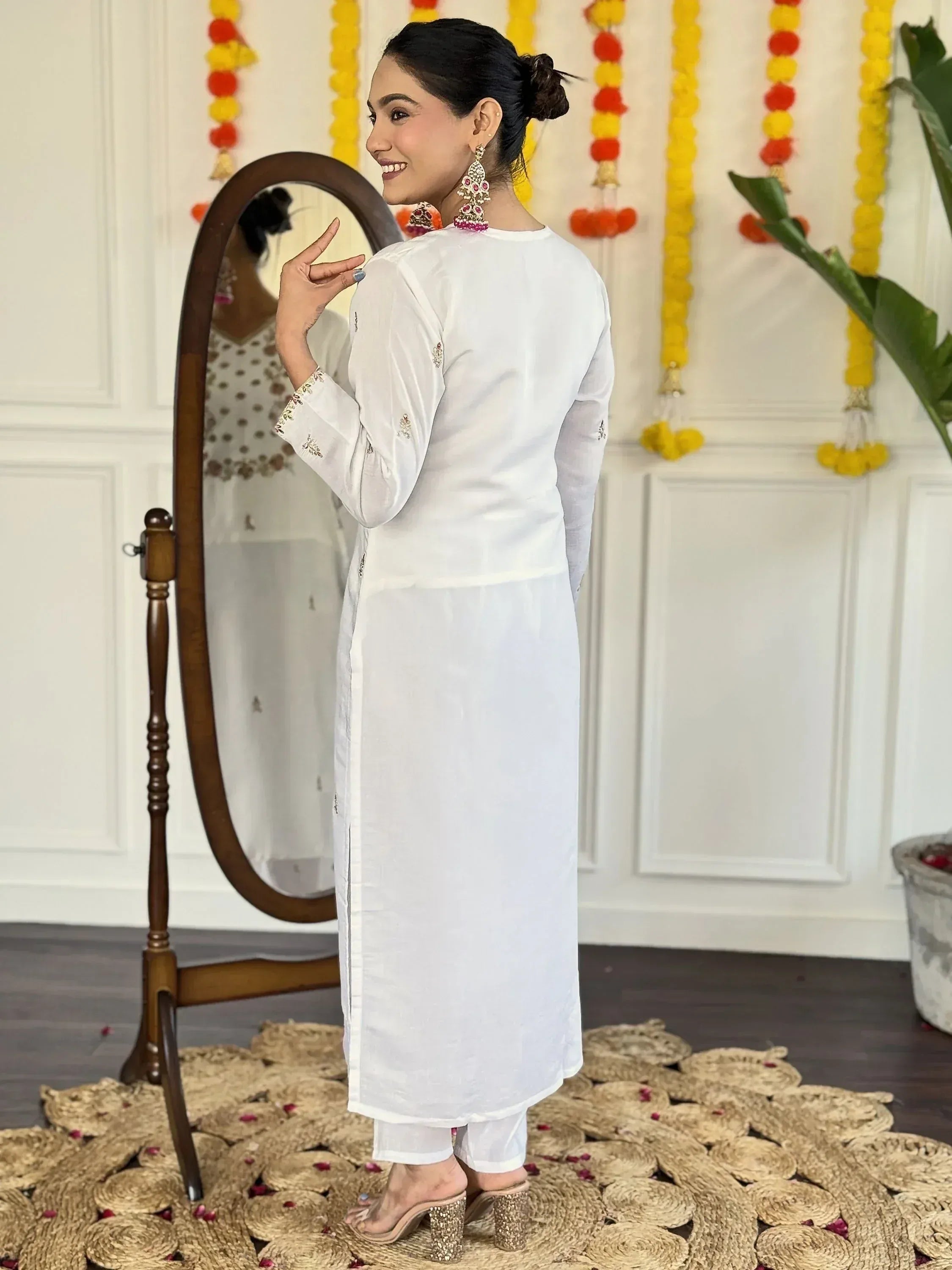 White embroidered kurta with palazzo pants, ethnic Indian wear for women, festive look with mirror and floral decor
