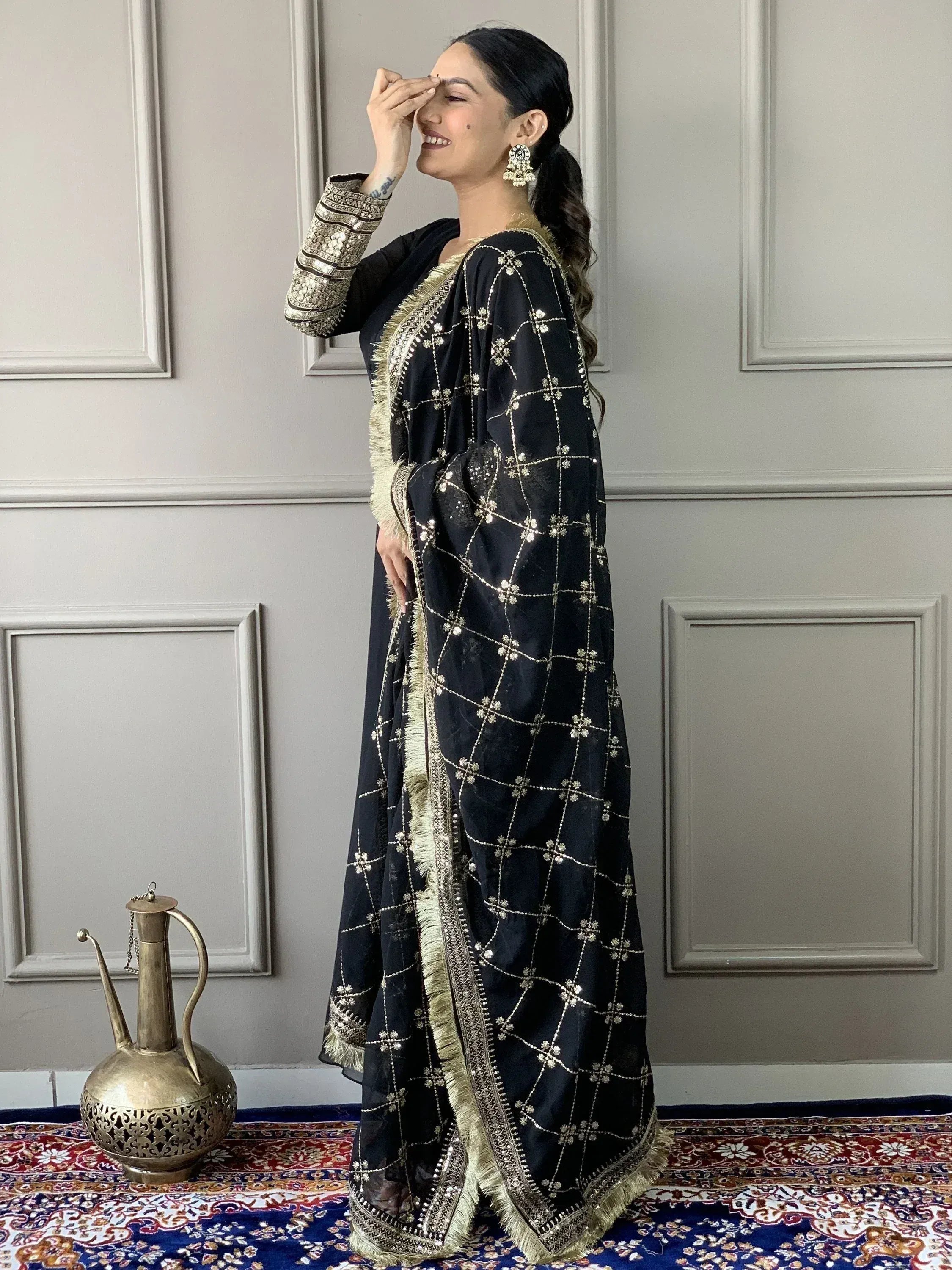 Black embroidered salwar kameez with gold detailing, perfect for Indian ethnic wear occasions