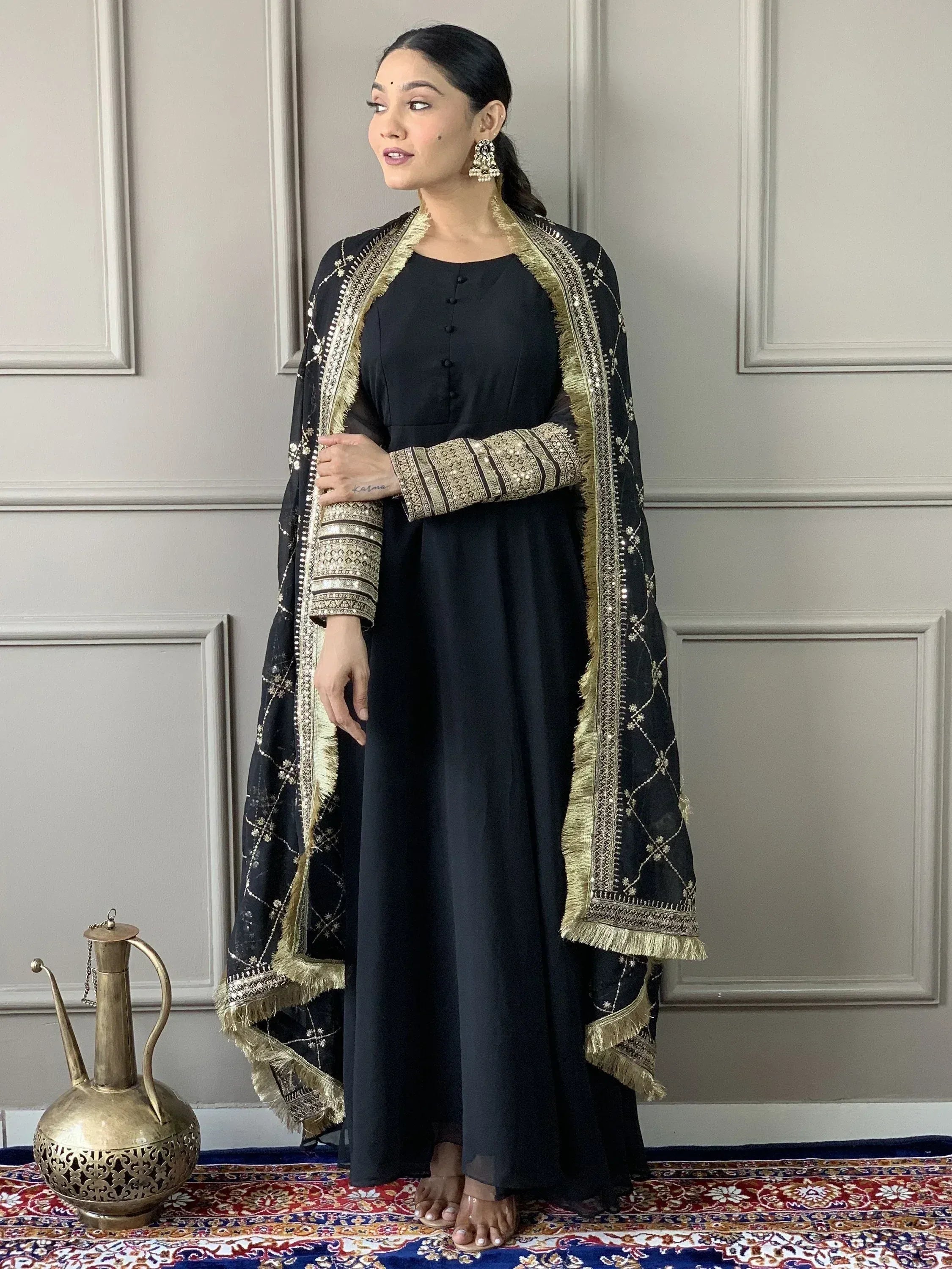 Black ethnic gown with gold embroidery and matching dupatta, perfect for Indian festive occasions