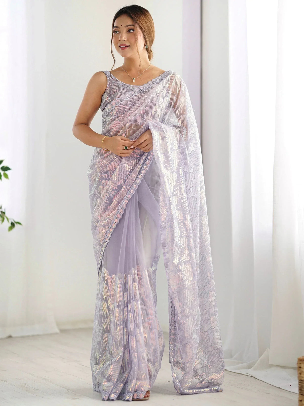 Lavender designer saree with sequin embroidery and lace border, perfect for Indian ethnic wear occasions