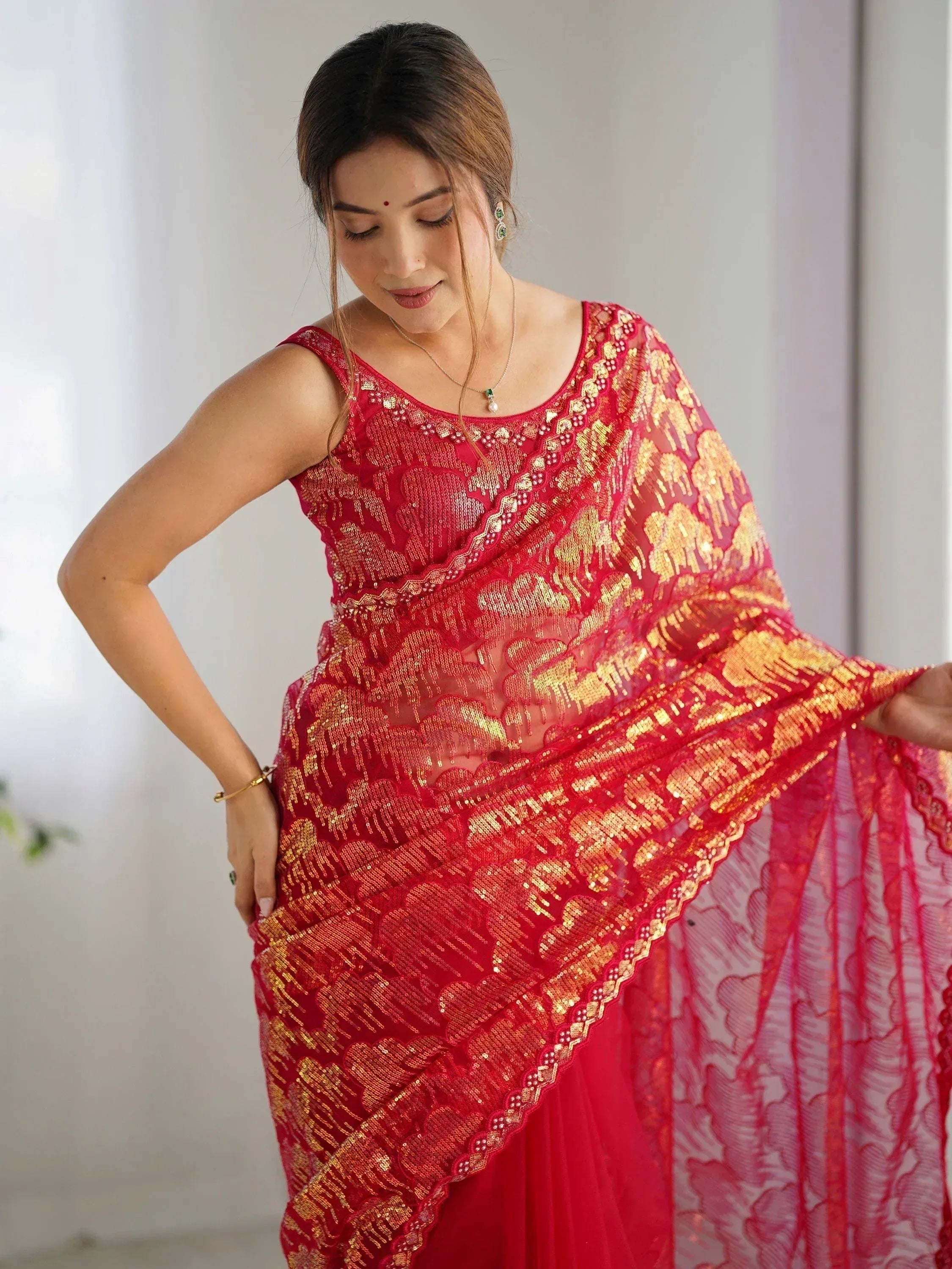 Red and gold sequin saree with lace detailing, elegant ethnic wear for women