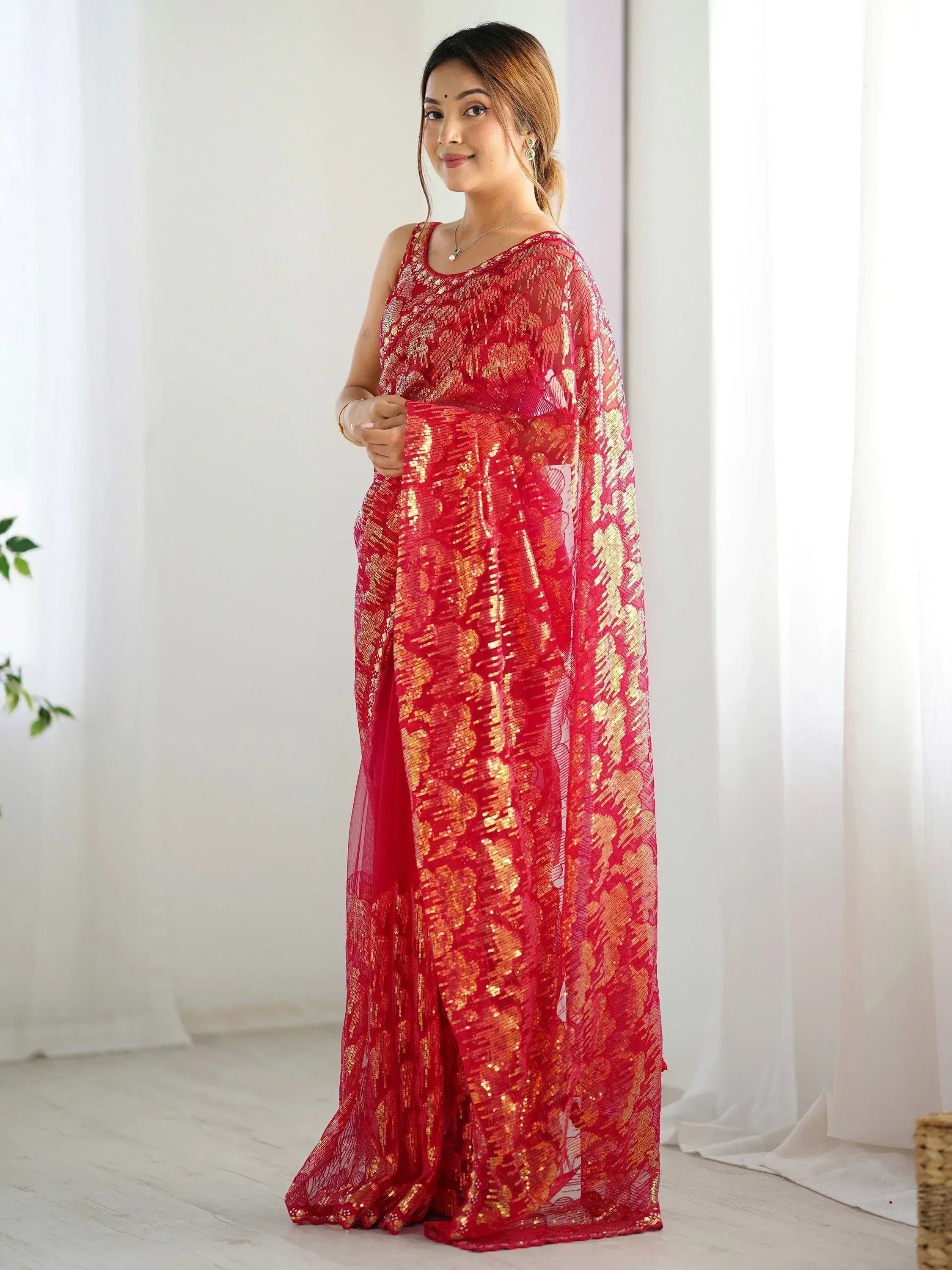 Red and gold embroidered saree with sheer overlay, perfect for Indian ethnic occasions