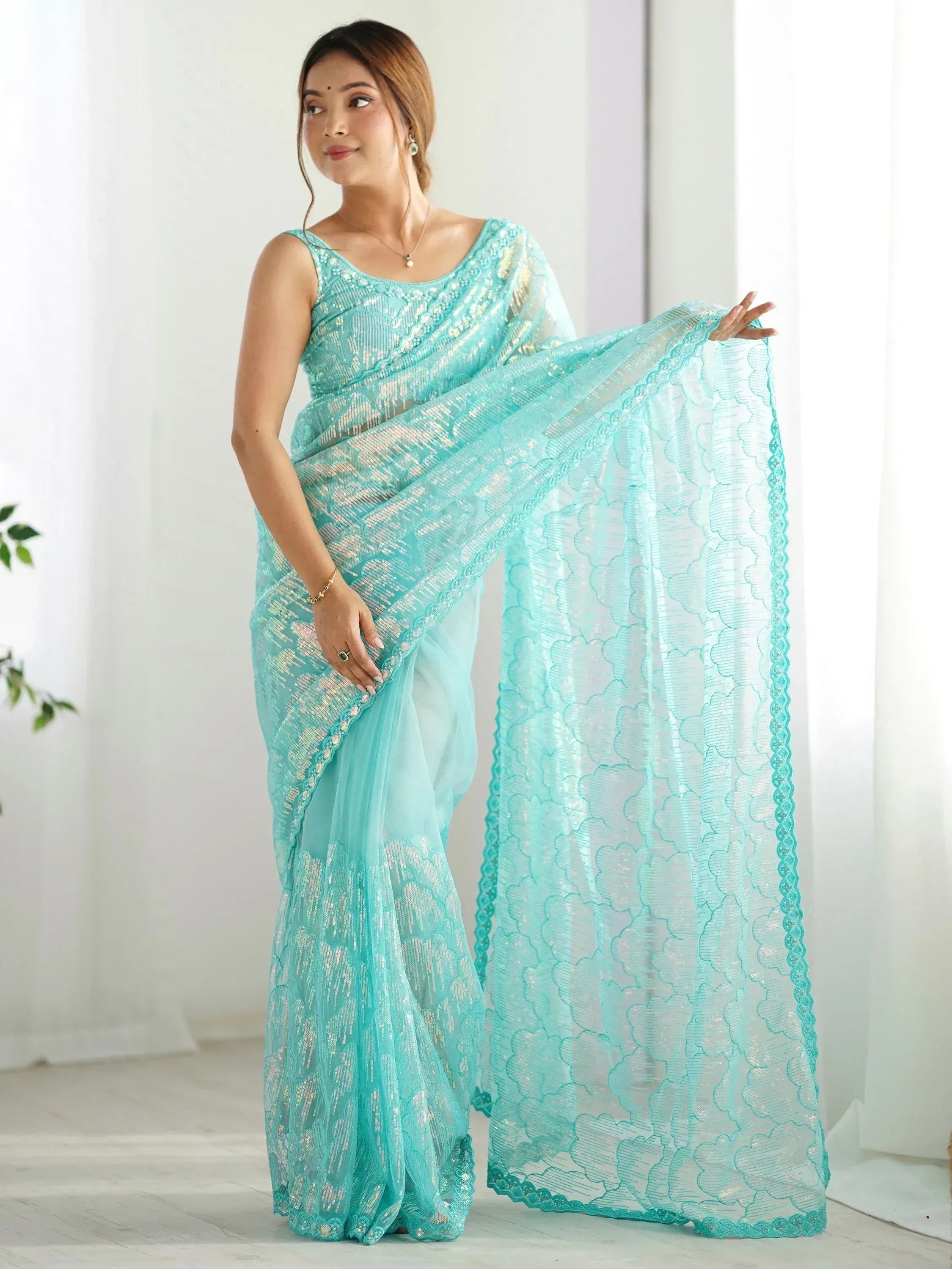 Mint green embroidered saree with sequin work, perfect for Indian ethnic wear occasions