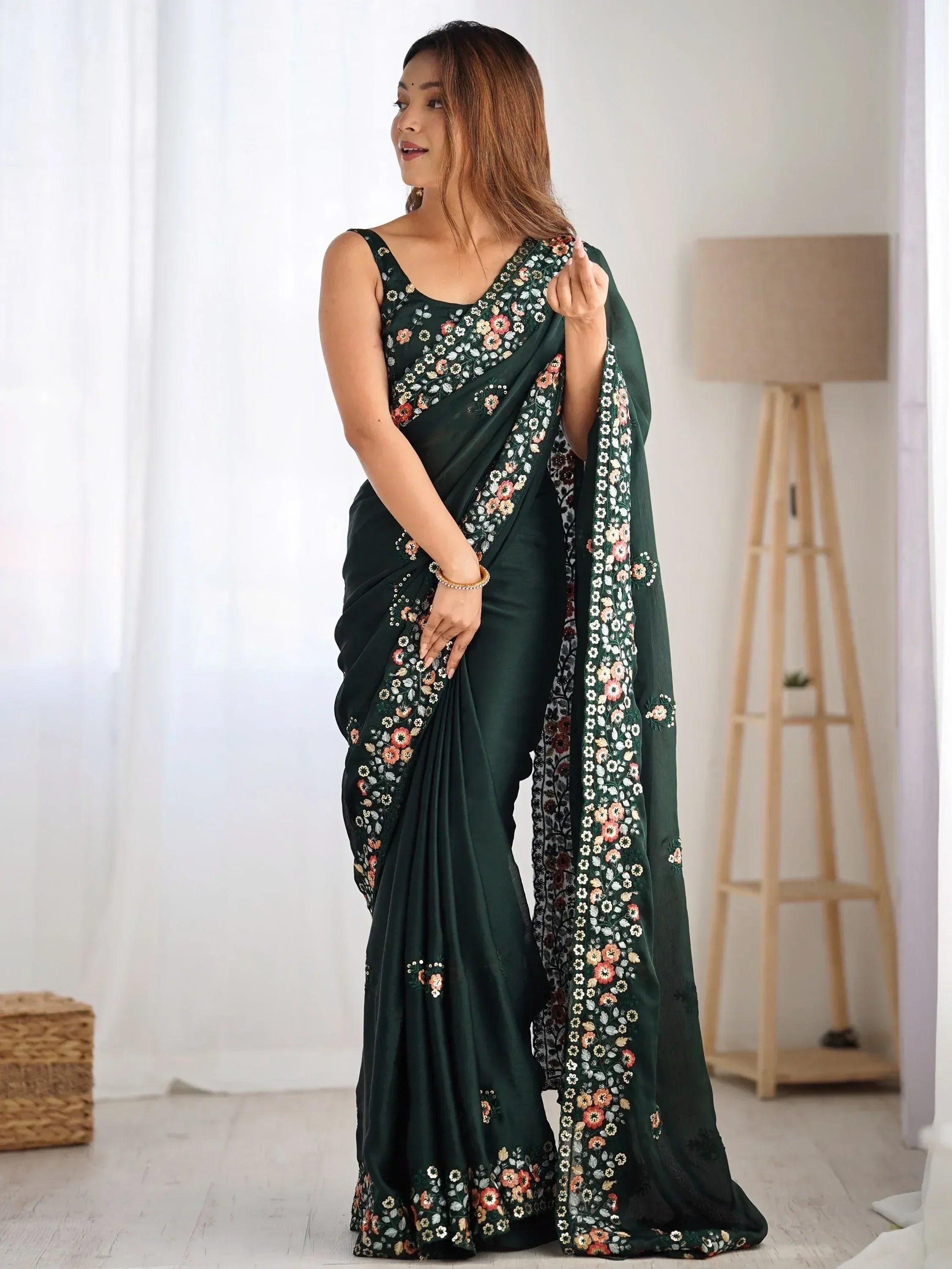 Woman in dark green floral embroidered saree with matching blouse, Indian ethnic wear