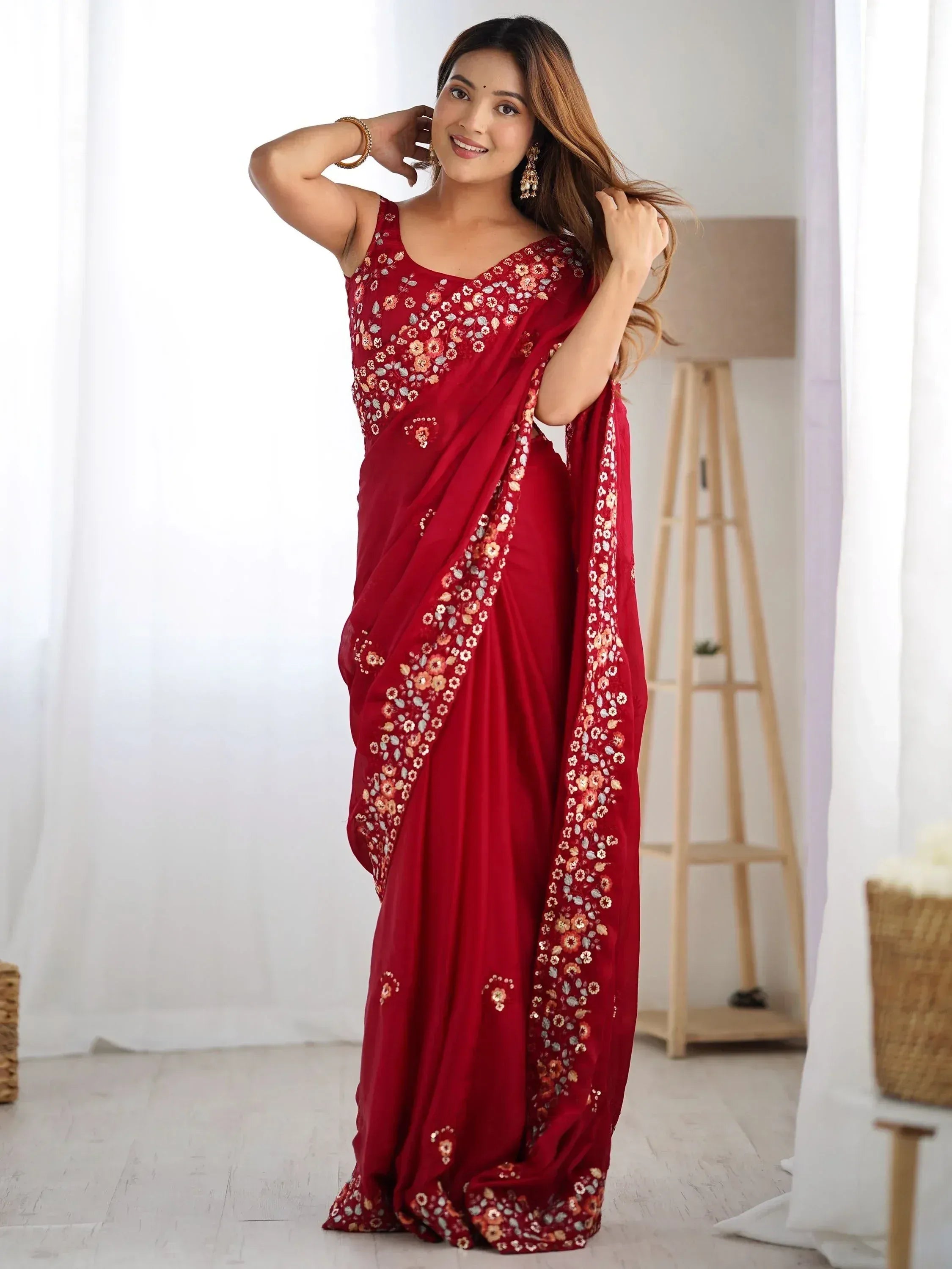 Woman in red floral embroidered saree, Indian ethnic wear for festive occasions
