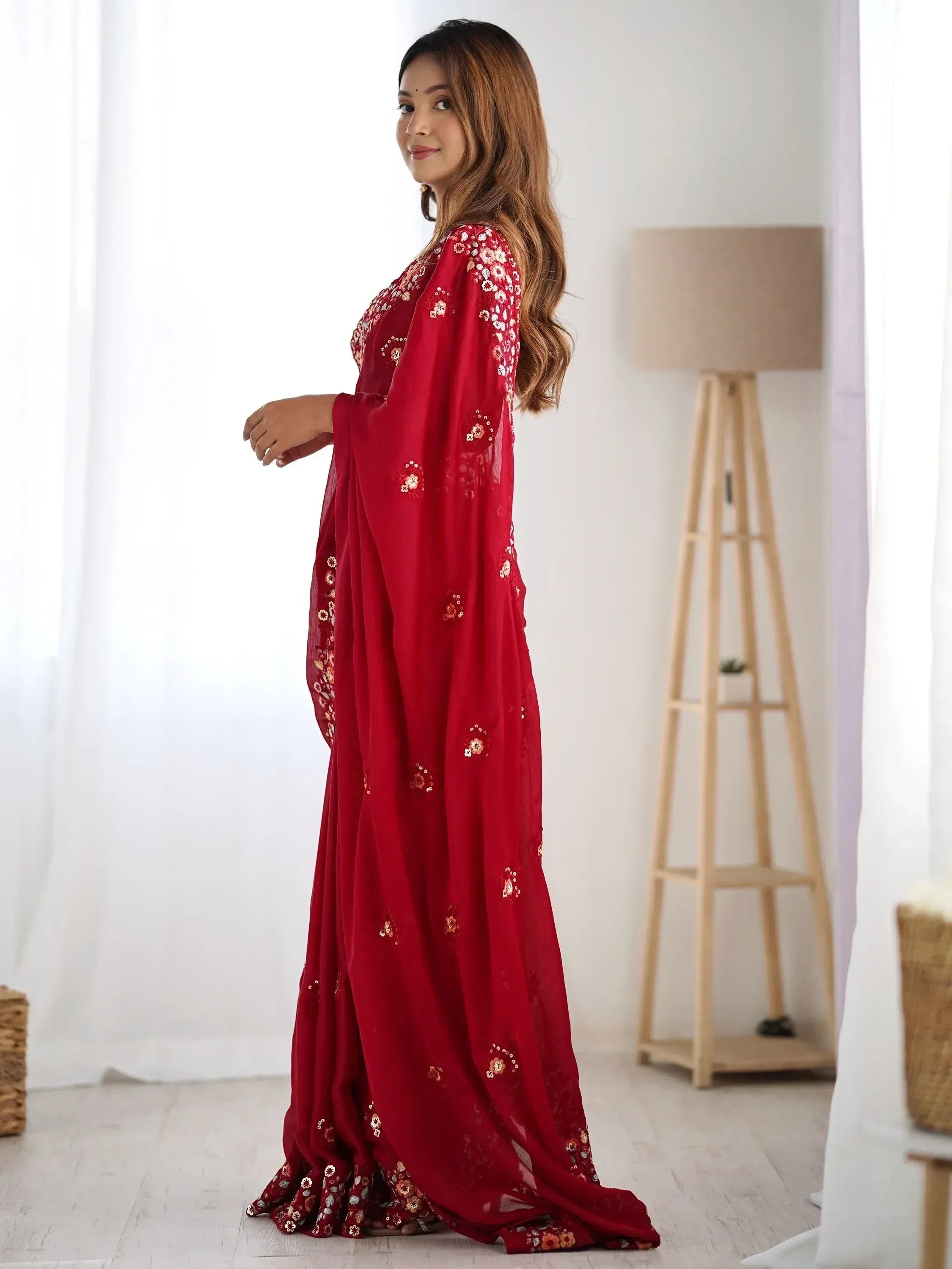 Red embroidered ethnic gown with floral sequin detailing, perfect for Indian occasions and festive wear.