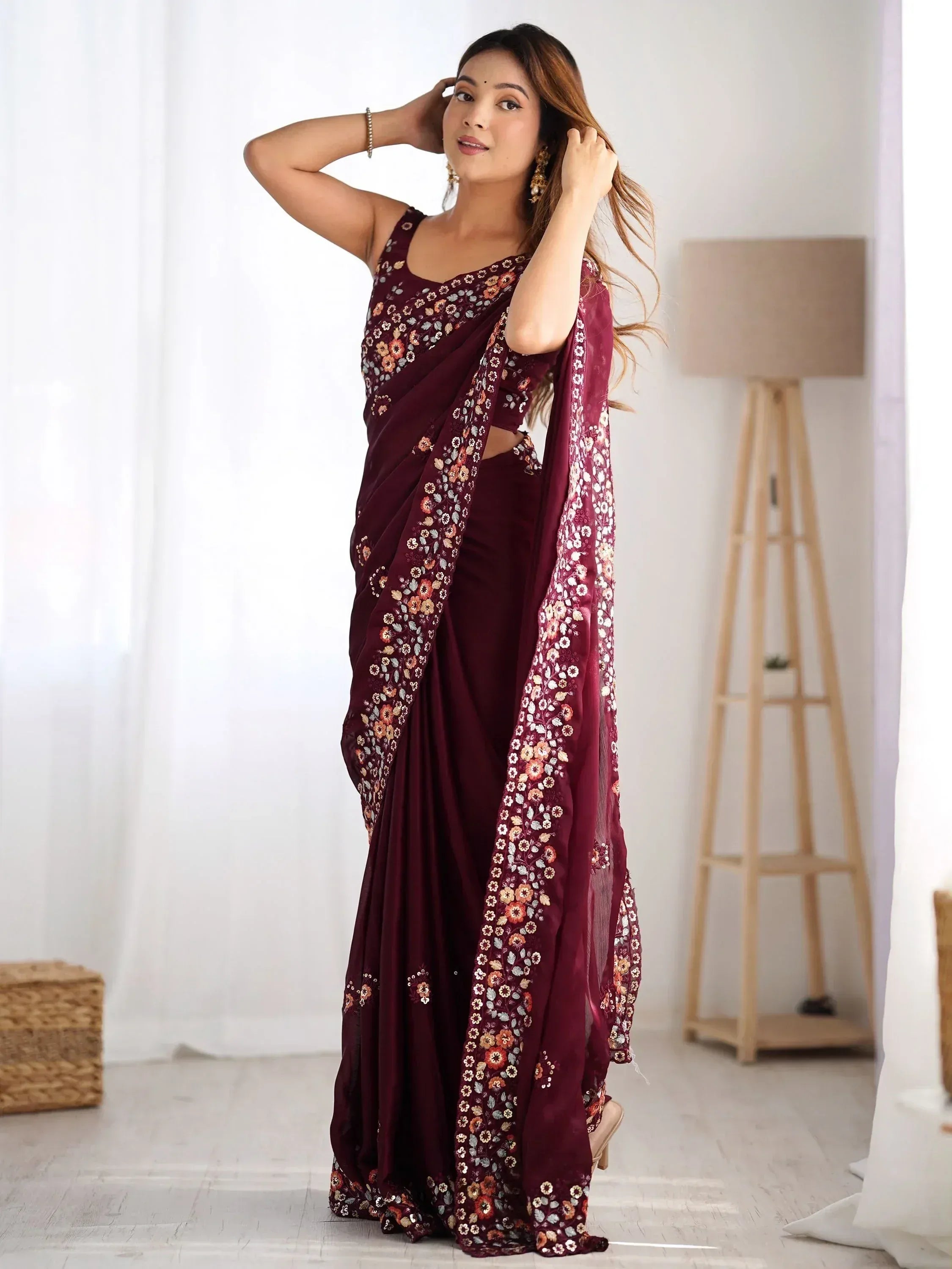Woman in maroon floral embroidered saree with matching blouse, Indian ethnic wear
