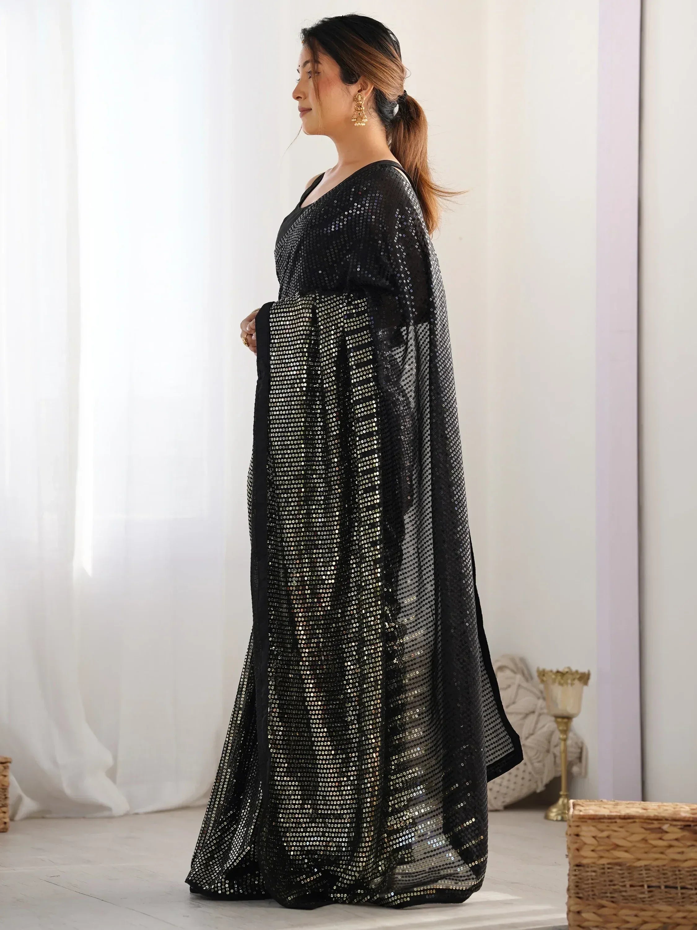 Black sequin ethnic gown with sheer overlay, perfect for festive occasions and parties.