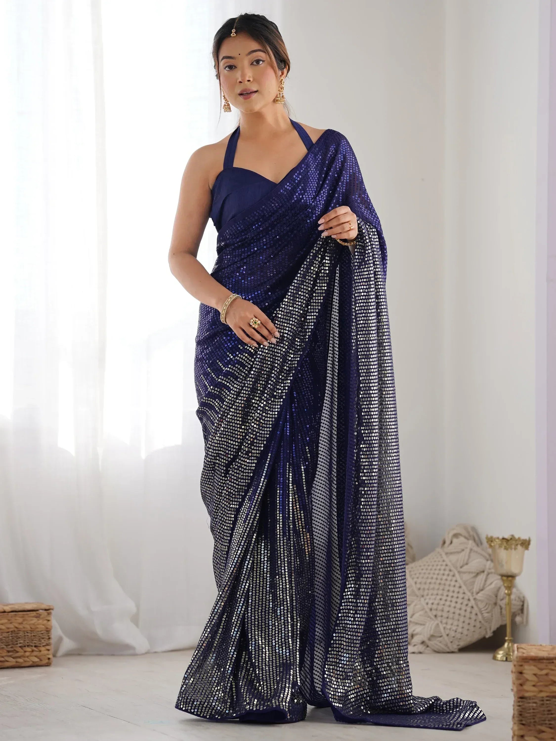 Navy blue sequin saree with halter neck blouse, perfect for Indian ethnic occasions