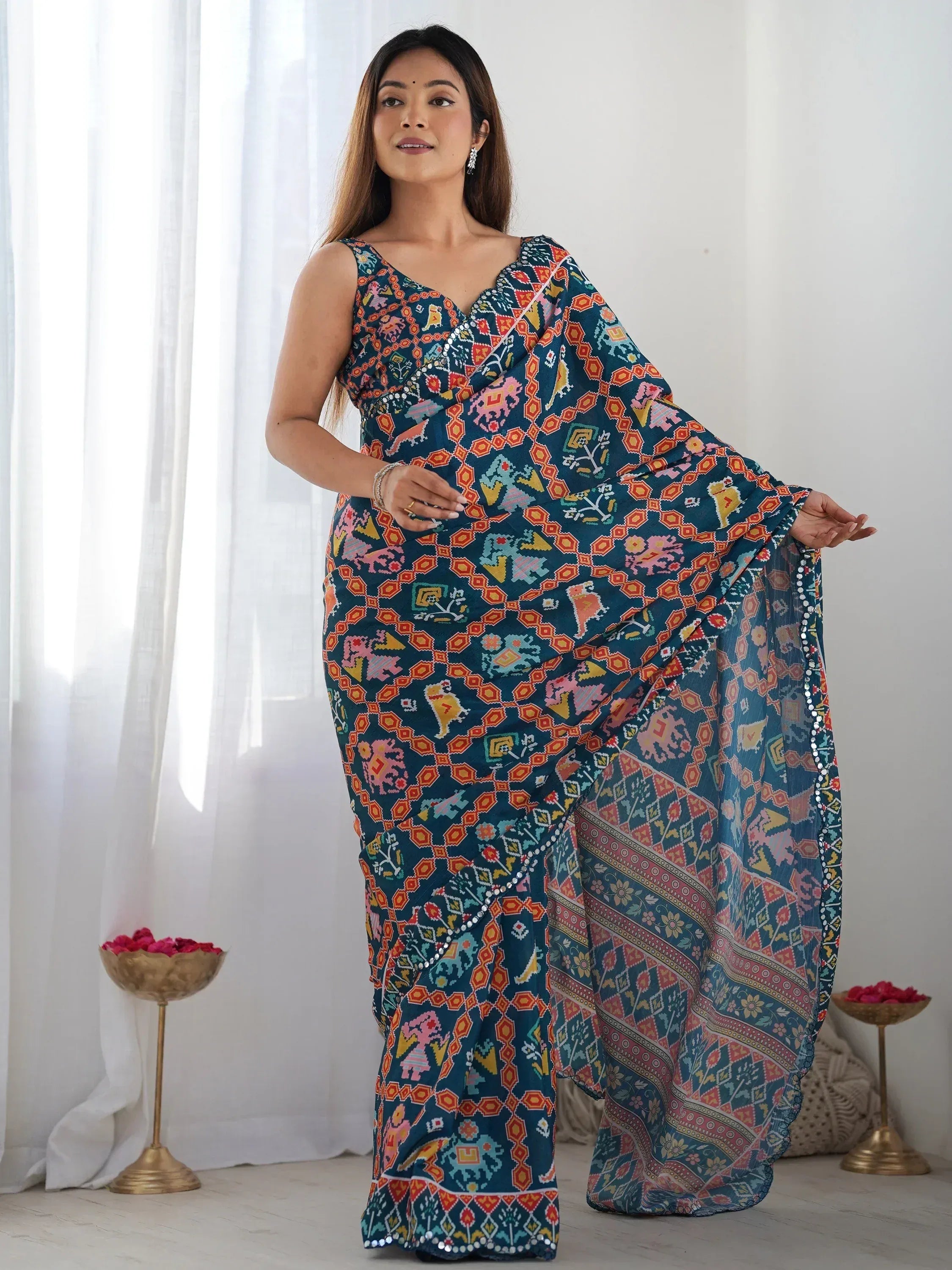 Woman in vibrant printed saree with ethnic motifs, perfect for Indian occasions and festive wear.