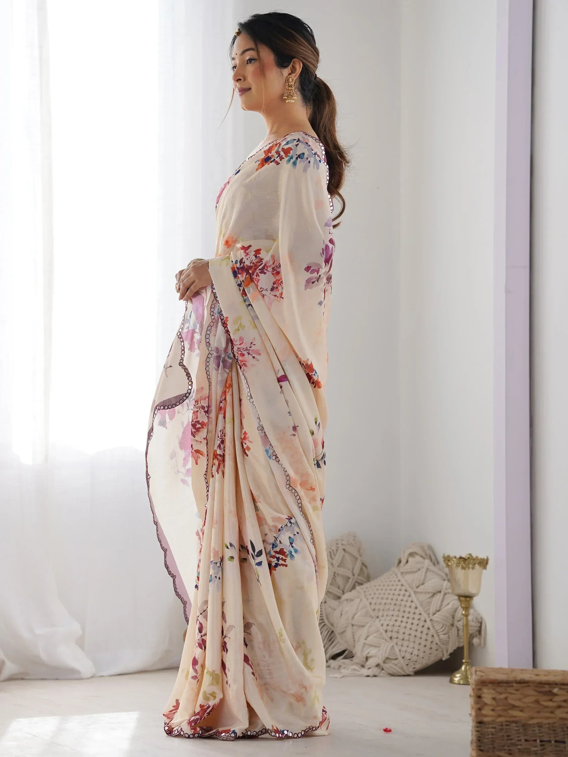 Woman in elegant floral print saree with sequin border, perfect for Indian ethnic occasions
