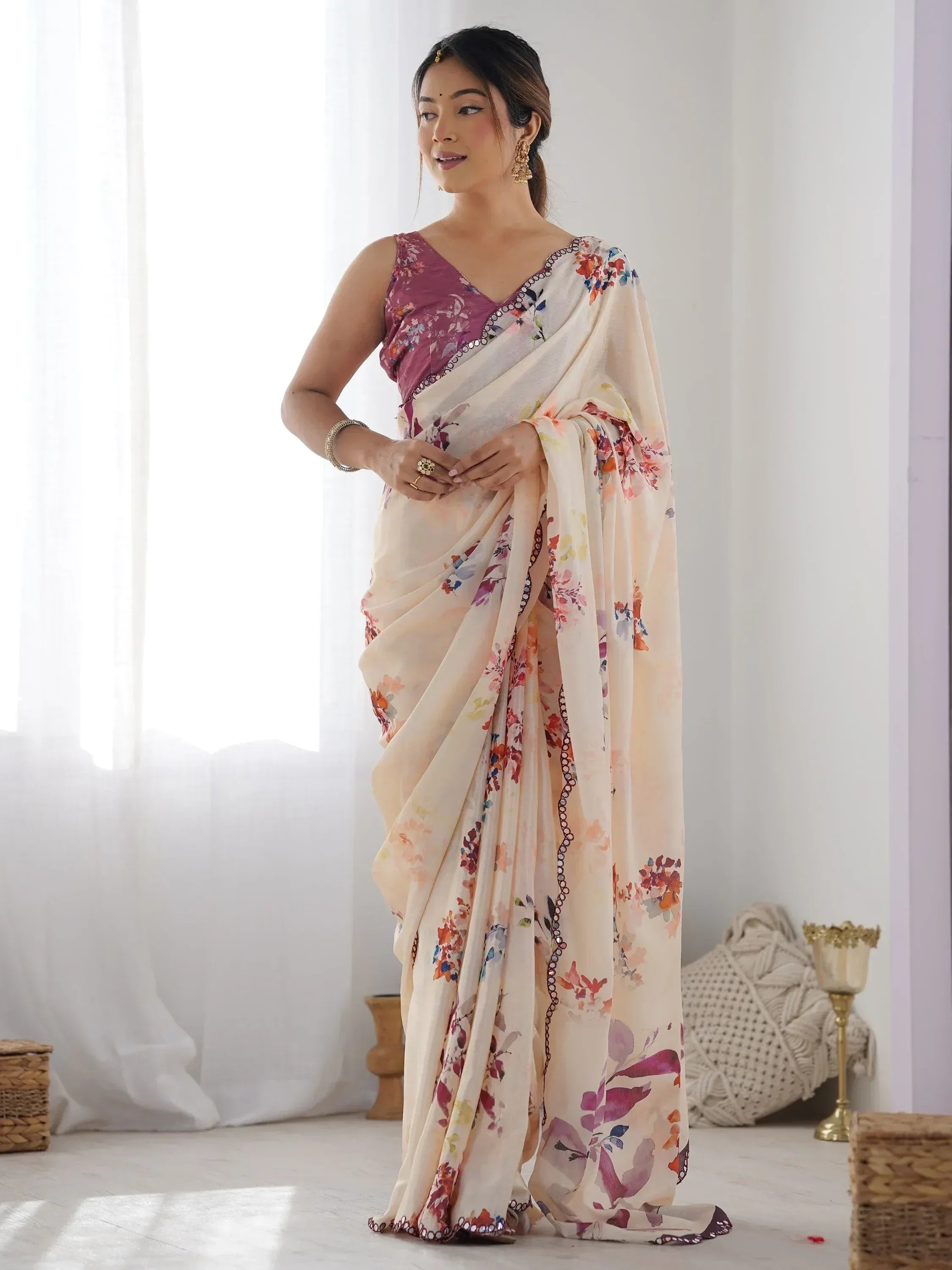 Woman in floral print saree with purple blouse, ethnic Indian wear for festive occasions