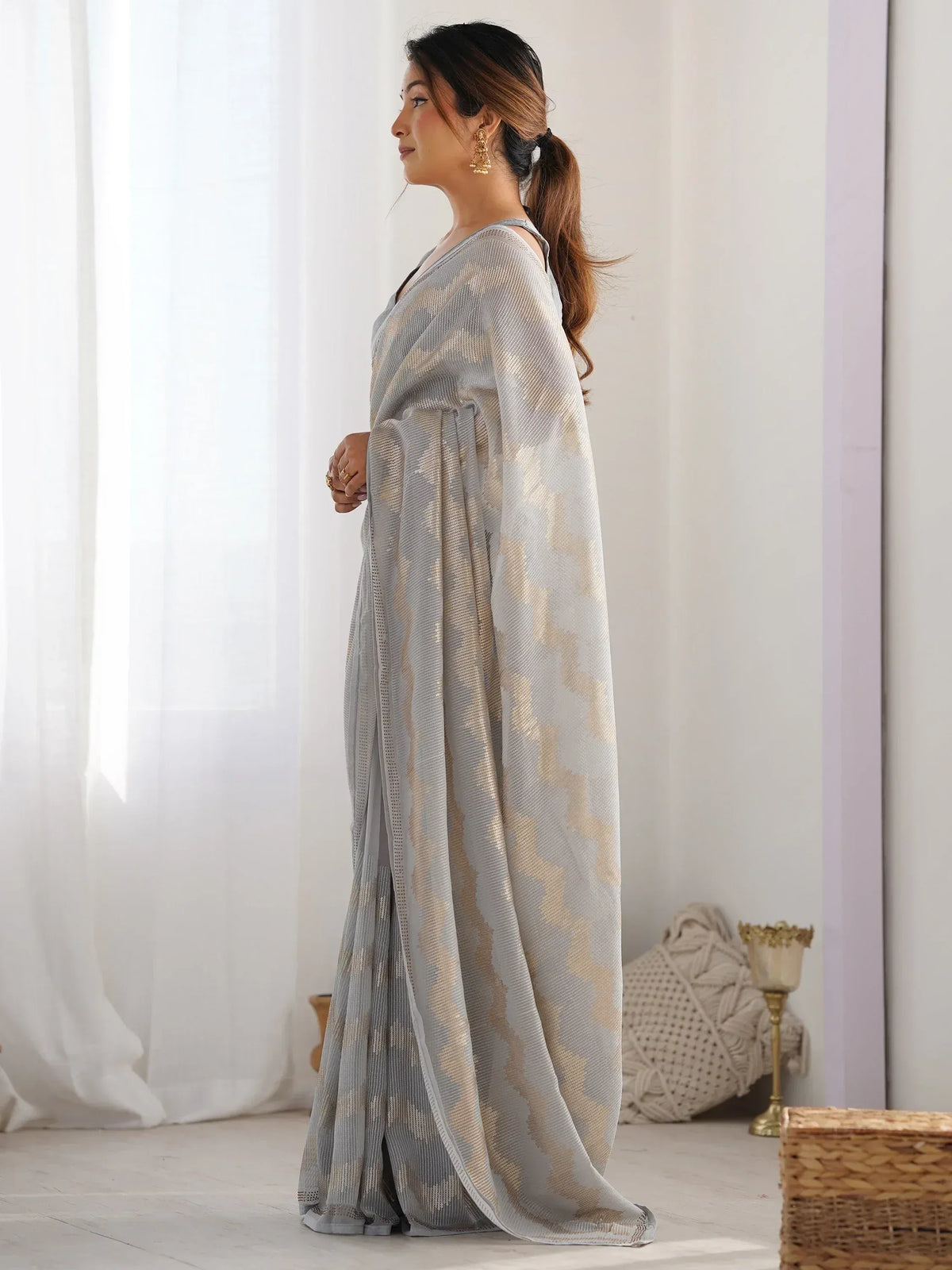 Woman in elegant grey and gold patterned saree, Indian ethnic wear, designer saree for women