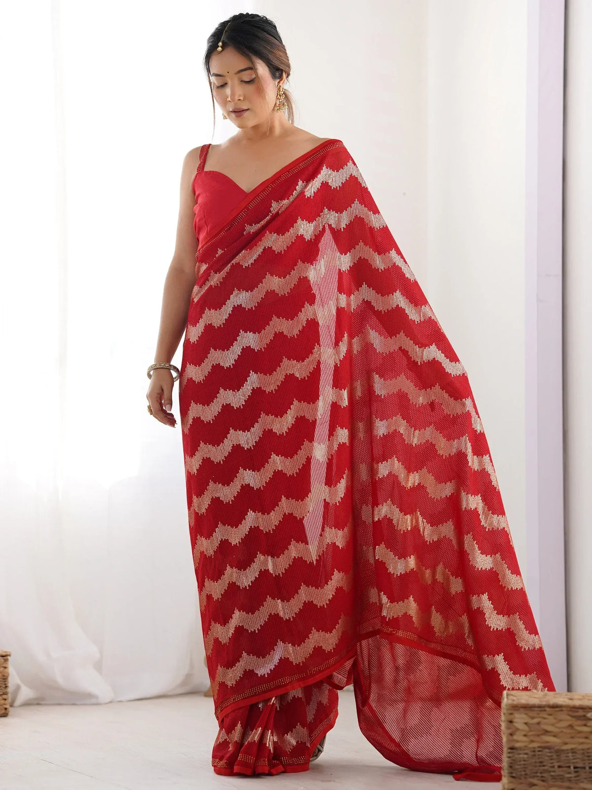 Red saree with gold zigzag pattern, ethnic Indian wear for women
