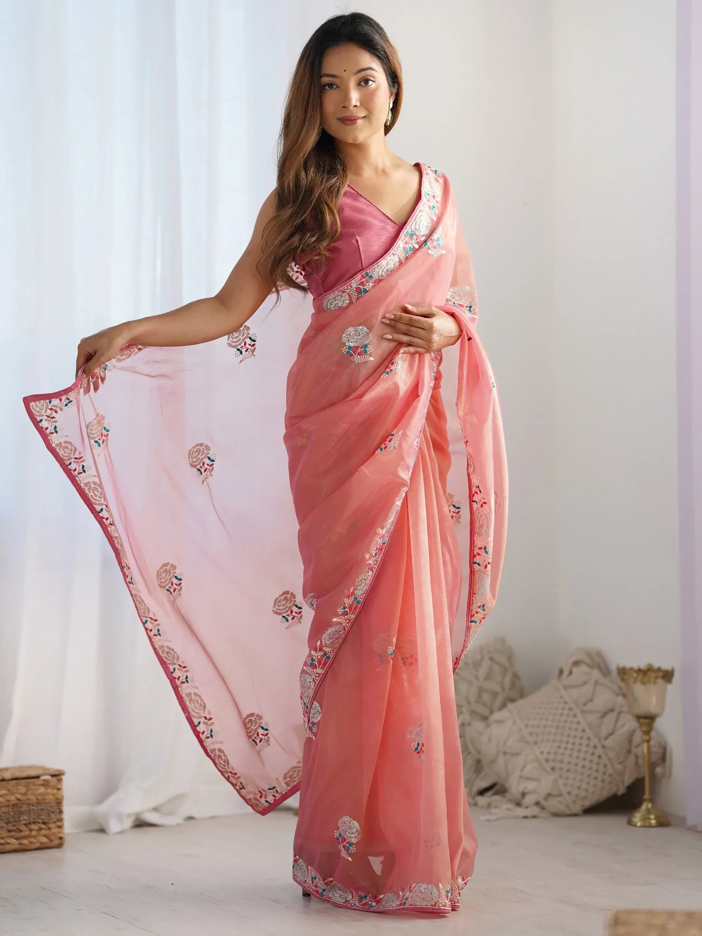 Pink embroidered saree with floral motifs, perfect for Indian ethnic wear occasions