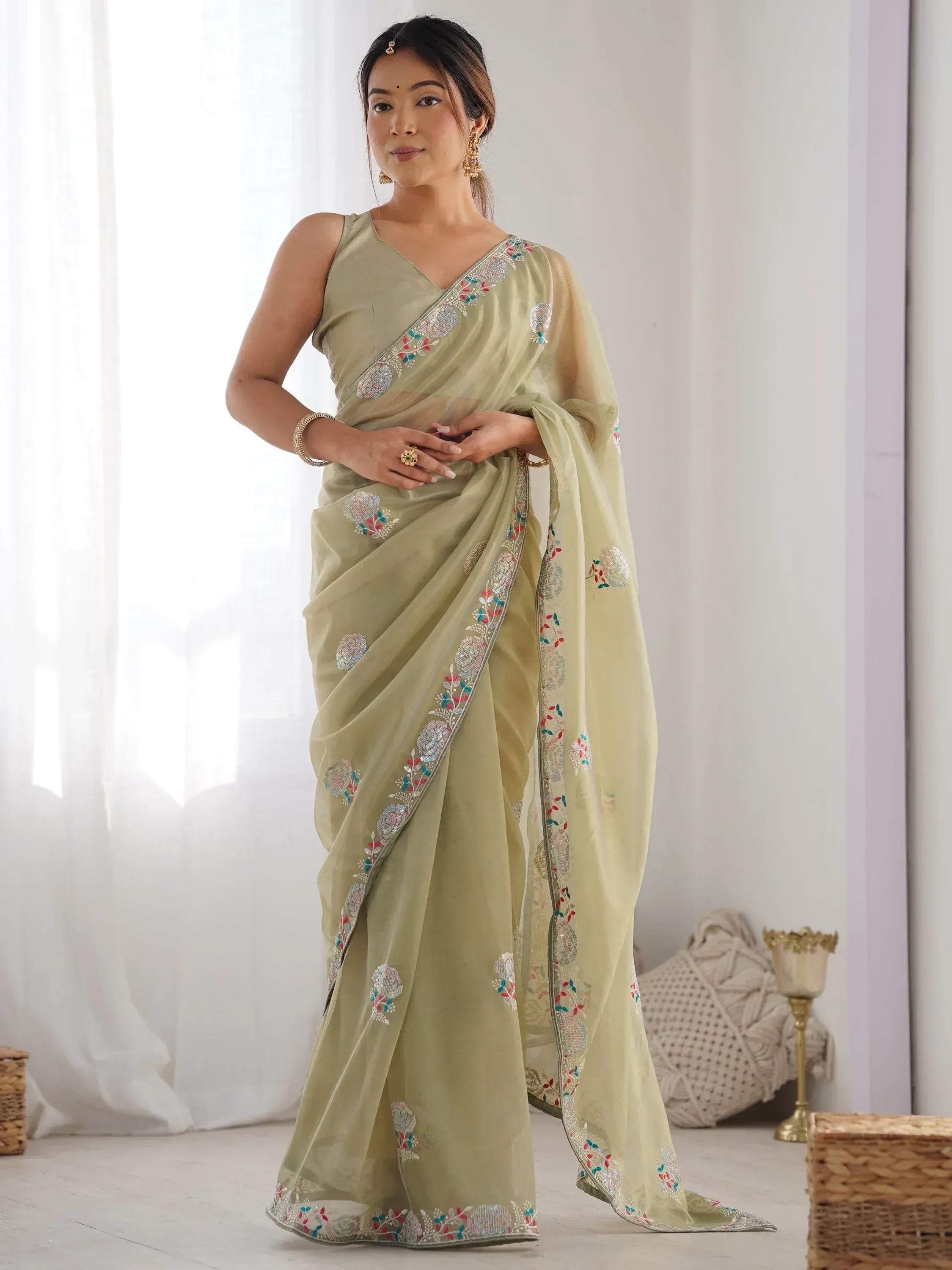 Elegant olive green saree with floral embroidery, perfect for Indian ethnic occasions and weddings.