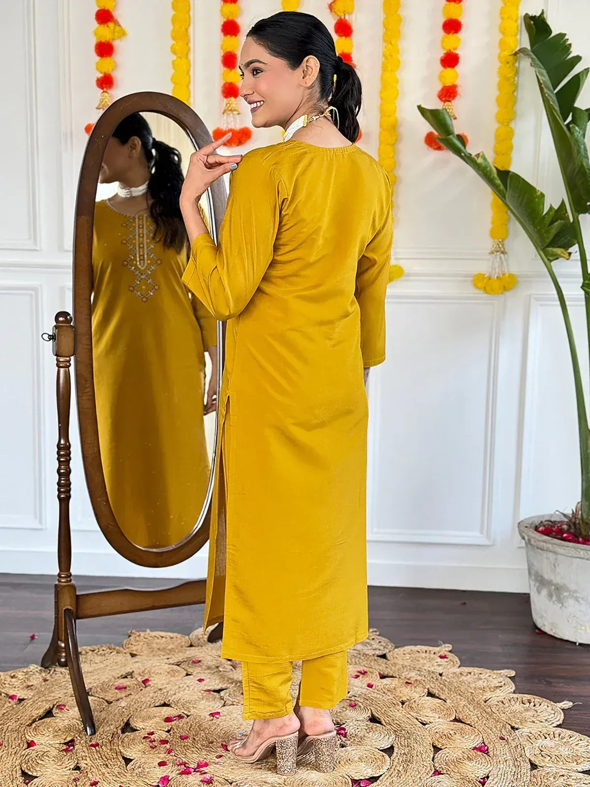 Mustard yellow velvet kurta with embroidery, paired with matching pants, perfect for ethnic occasions.