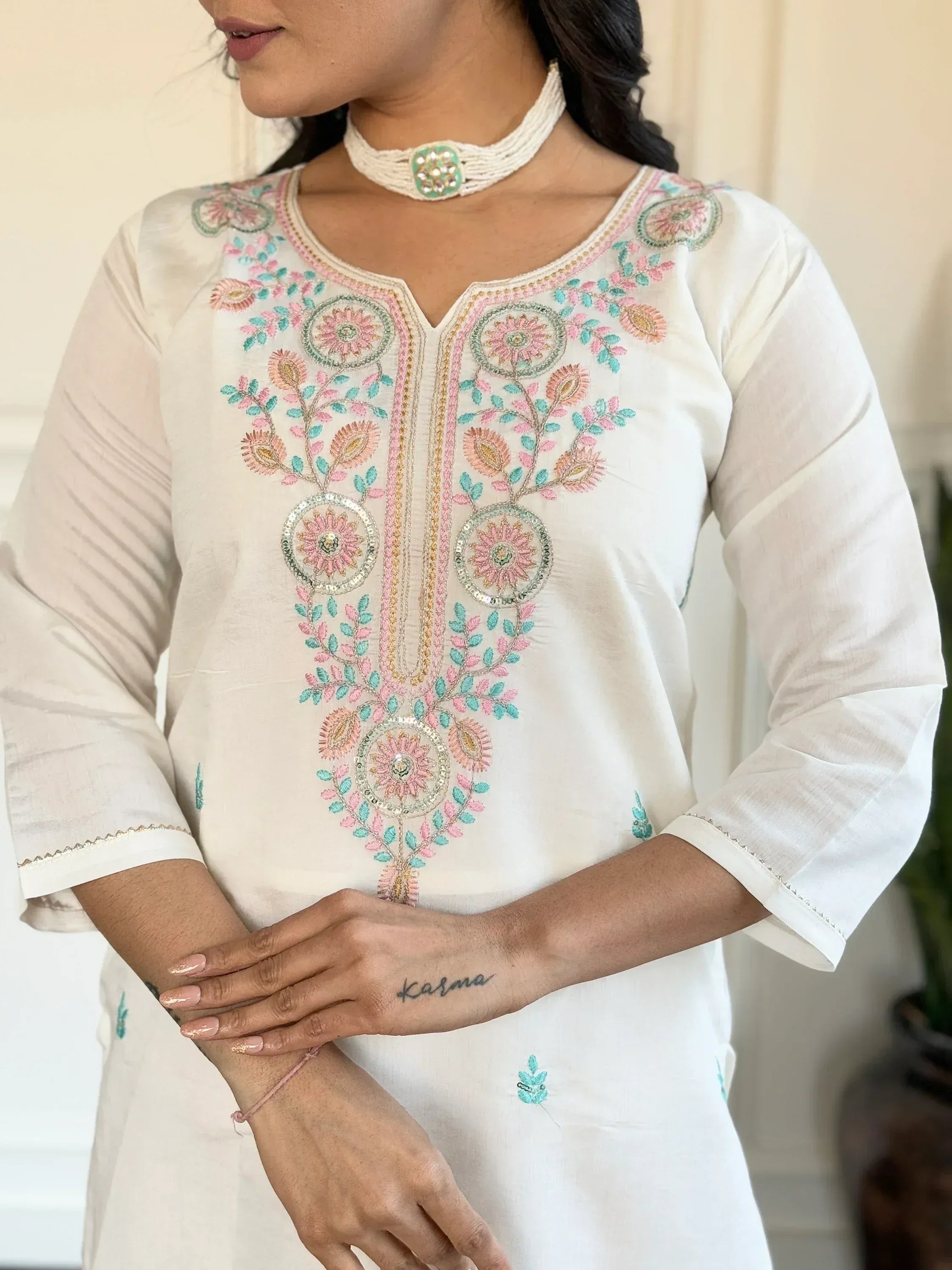 White embroidered kurta with pink and teal floral design, ethnic wear for women