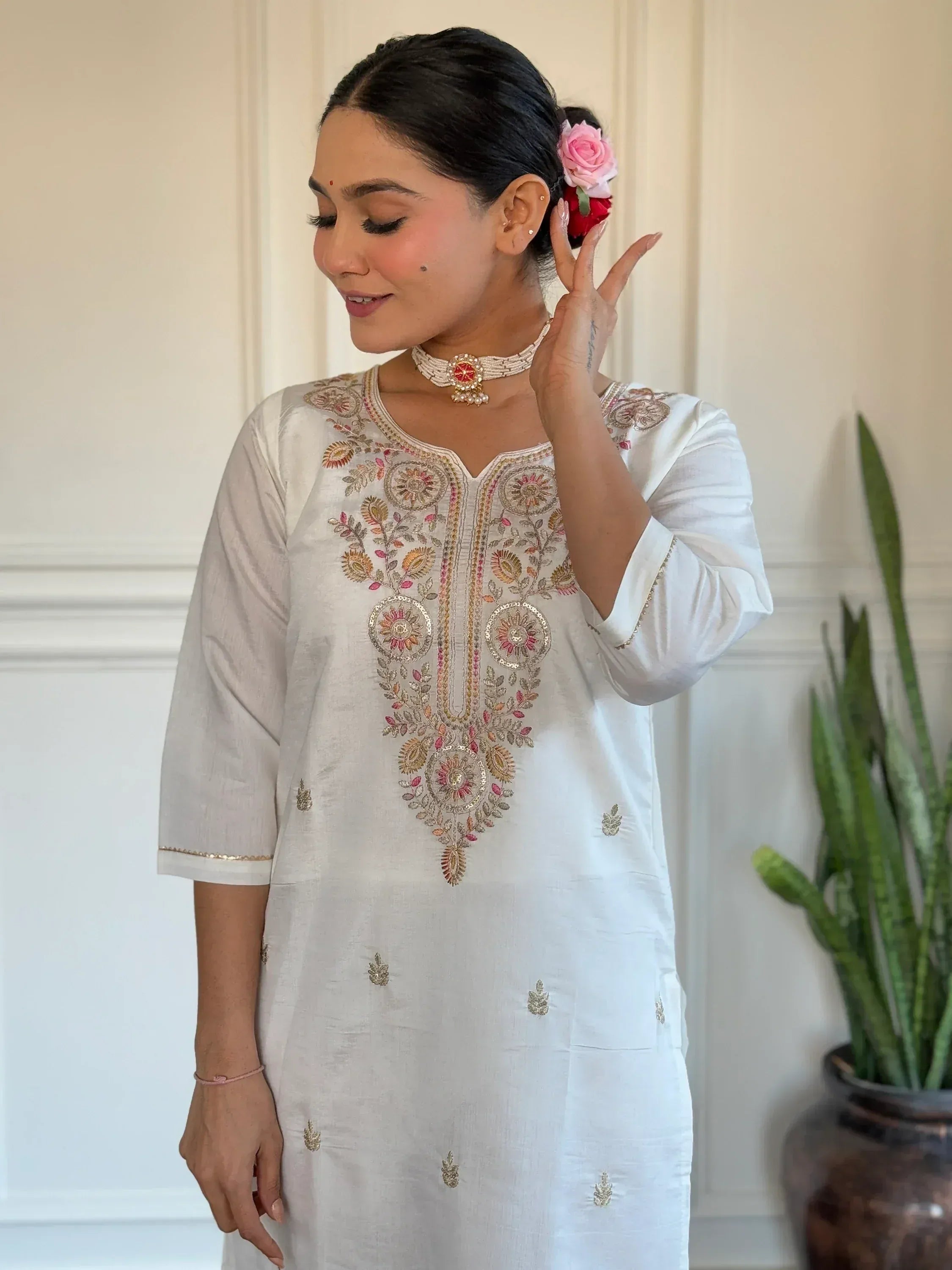 White embroidered kurta with floral design, perfect for Indian ethnic wear and festive occasions.