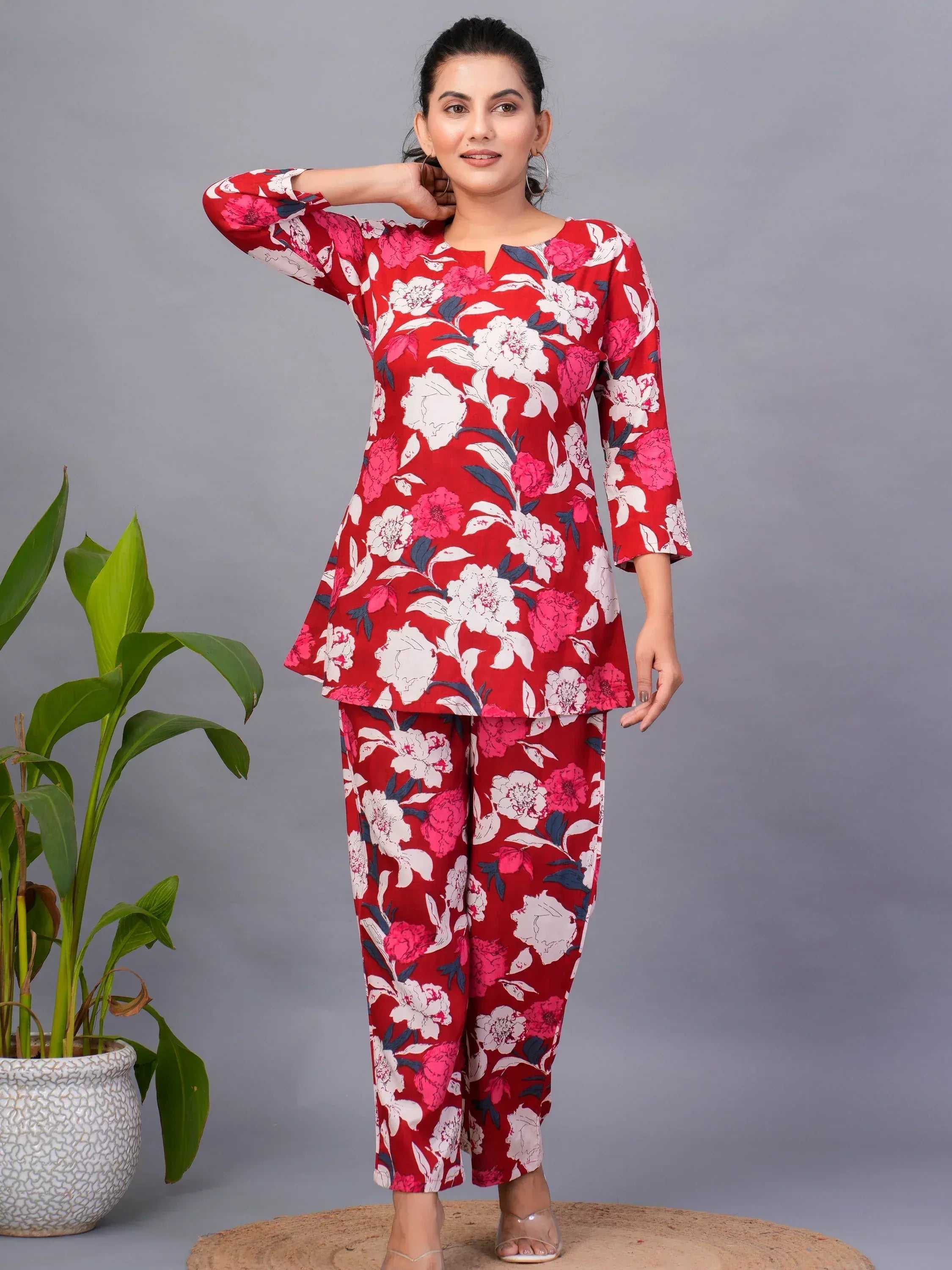 Red floral print salwar kameez with pink and white blooms, stylish ethnic wear for women