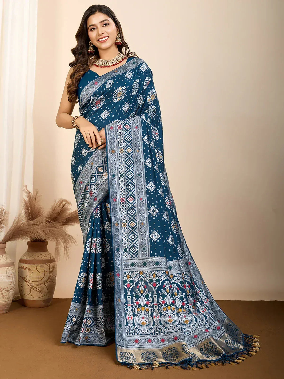 Blue printed saree with intricate geometric and floral patterns, perfect for ethnic occasions.