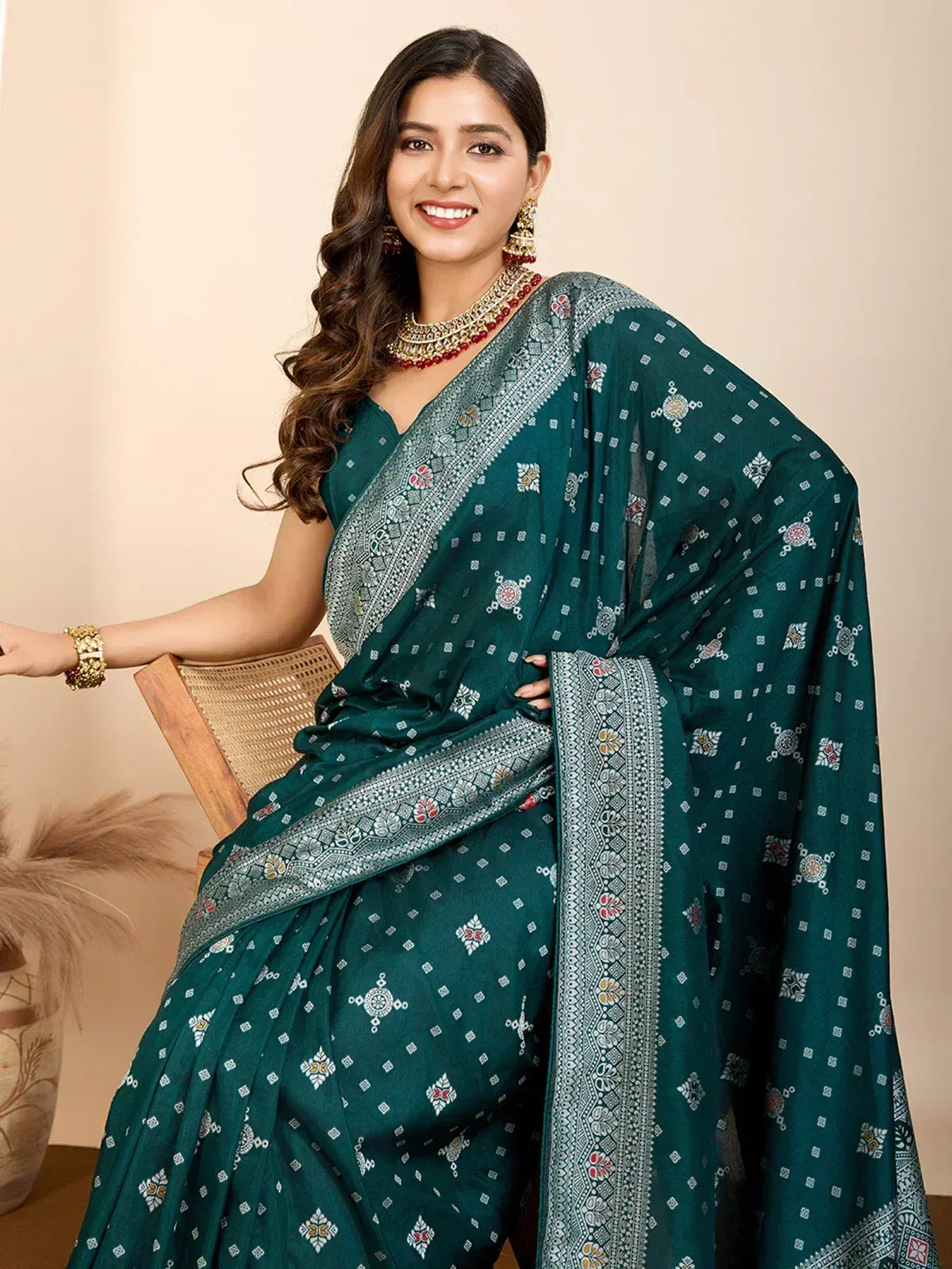 Emerald green printed saree with intricate border, perfect for Indian ethnic wear and festive occasions.
