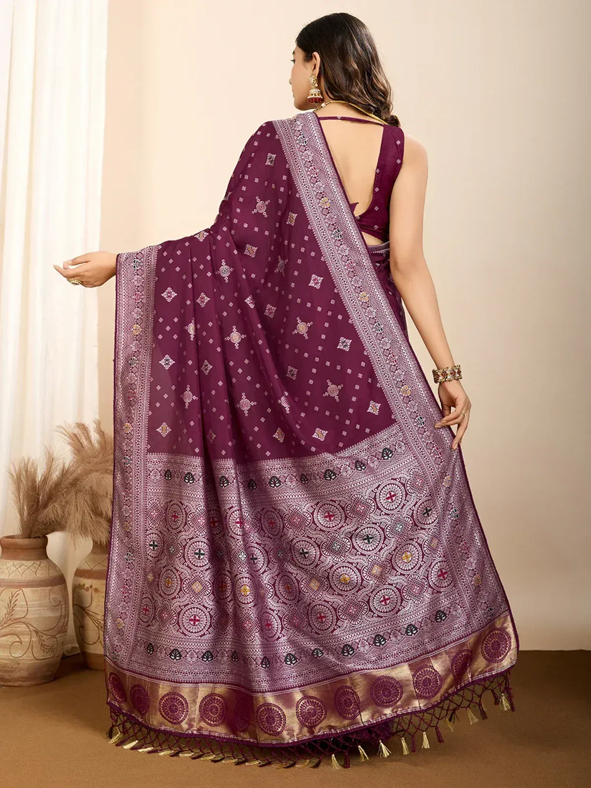Purple ethnic saree with intricate geometric print and golden border, perfect for Indian occasions