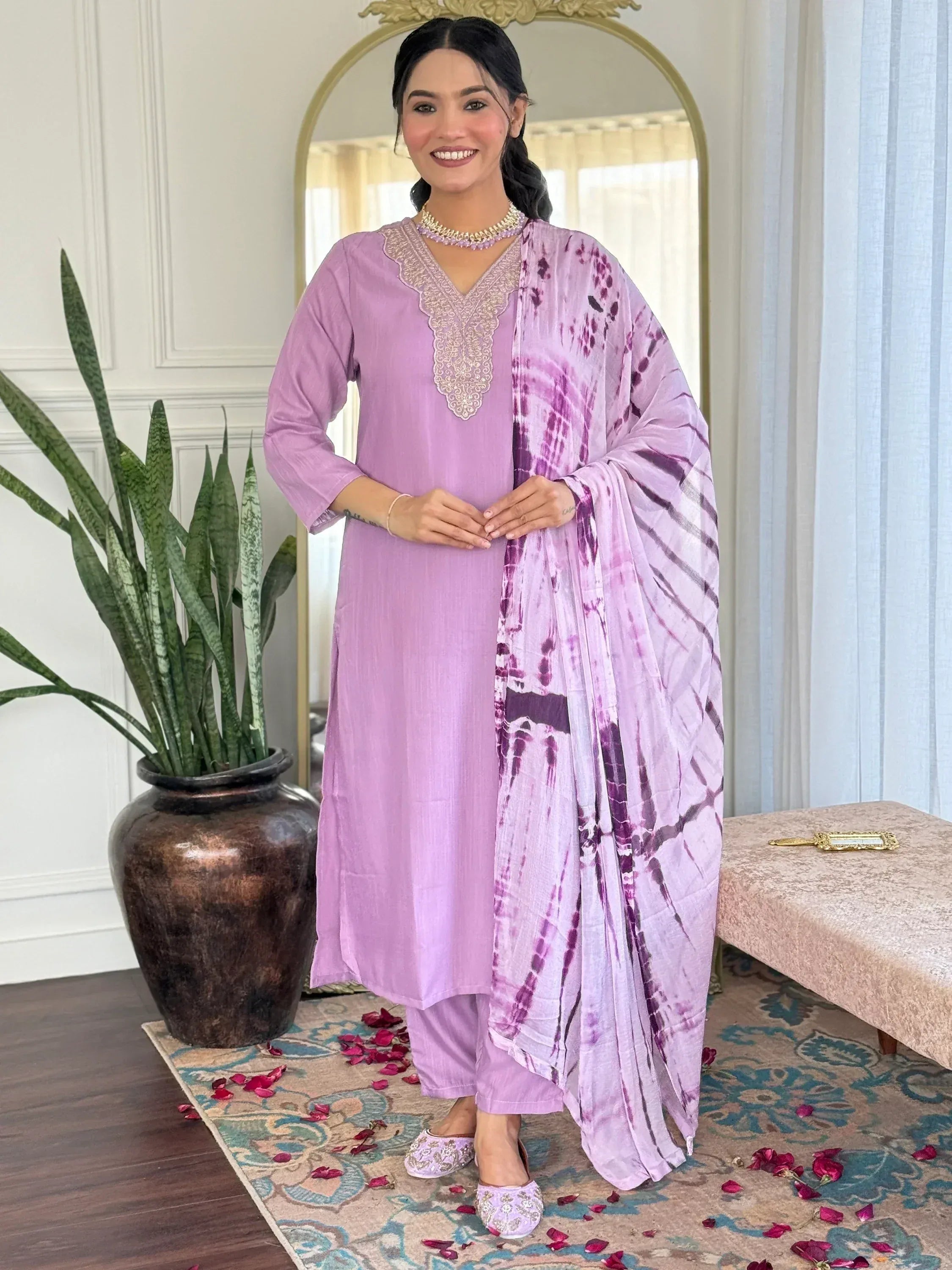 Lavender ethnic salwar kameez with embroidered neckline and tie-dye dupatta, perfect for Indian occasions.