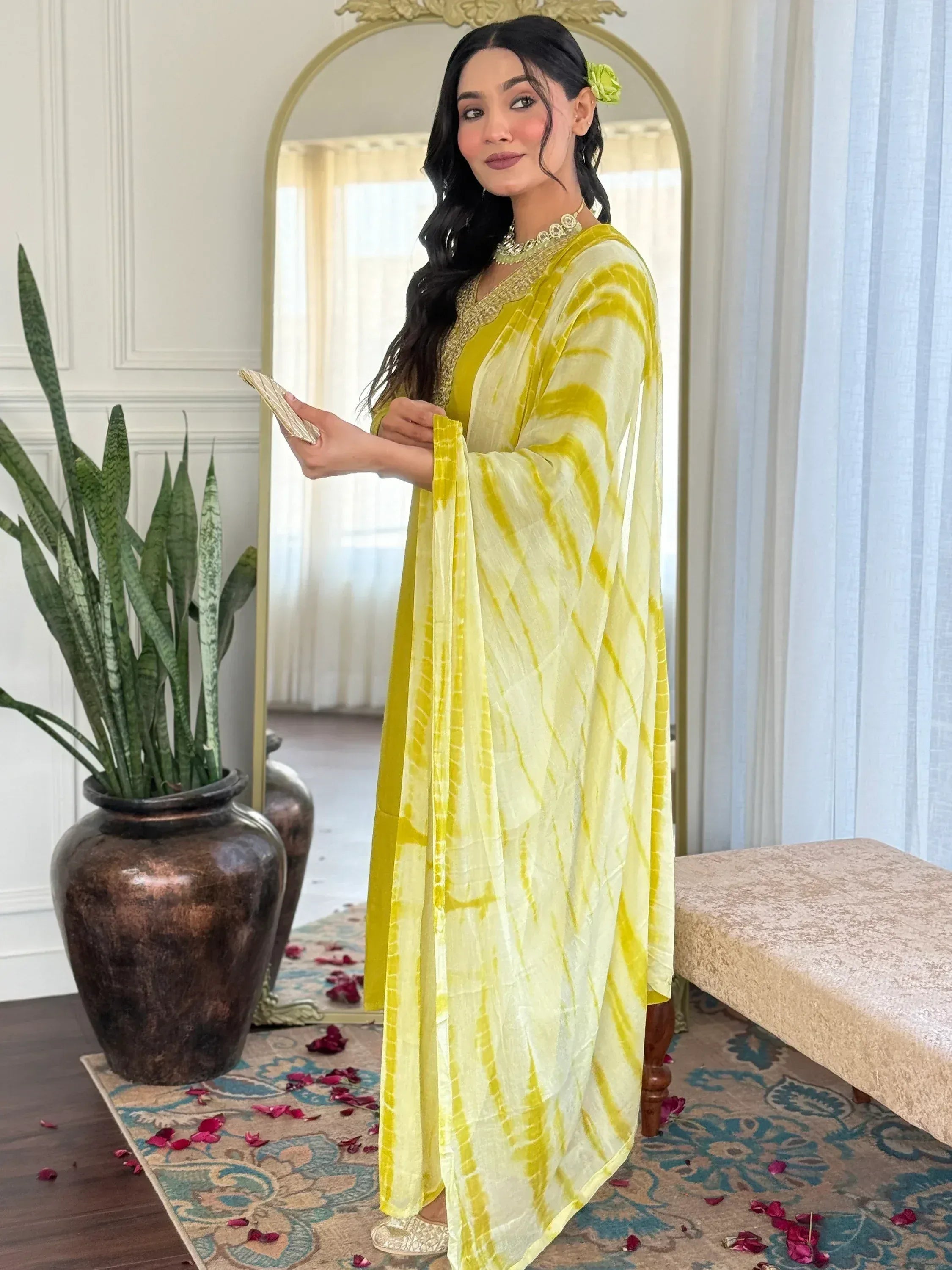 Yellow tie-dye ethnic gown with gold embroidery, perfect for Indian festive occasions