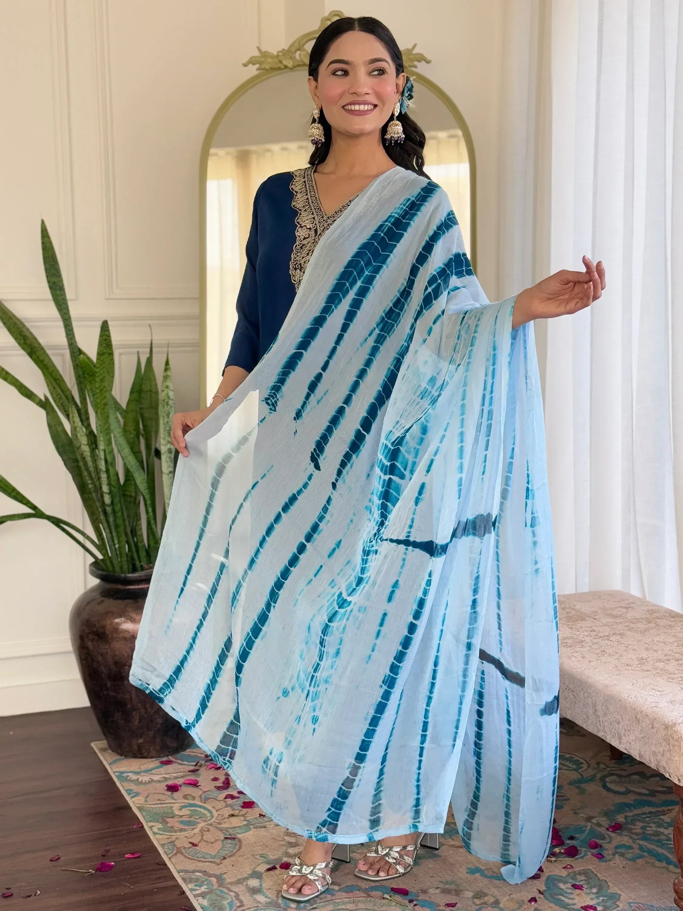 Blue tie-dye ethnic gown with embroidered neckline, perfect for Indian festive occasions