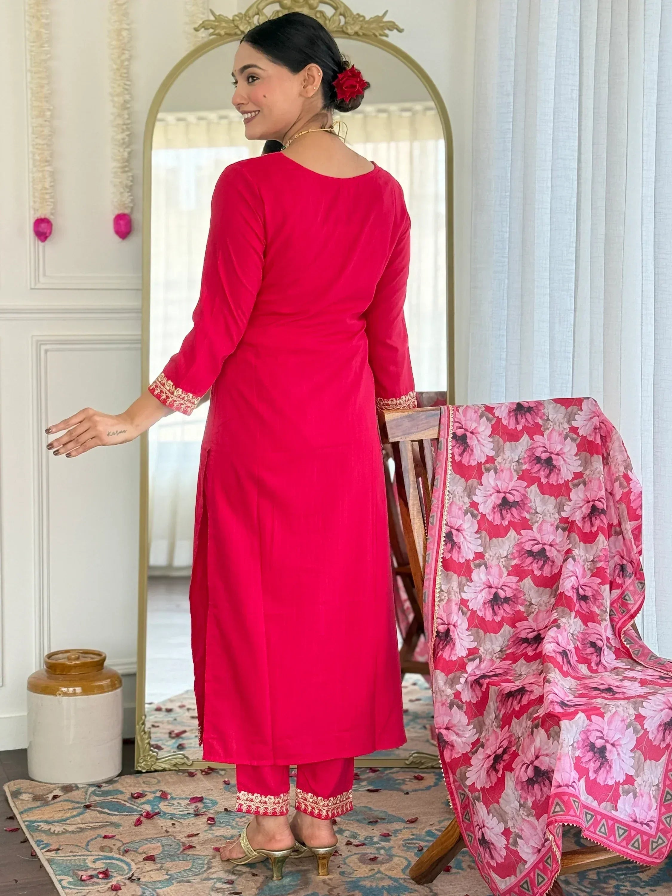 Vibrant pink ethnic kurti with gold embroidery paired with floral dupatta, perfect for Indian wear.