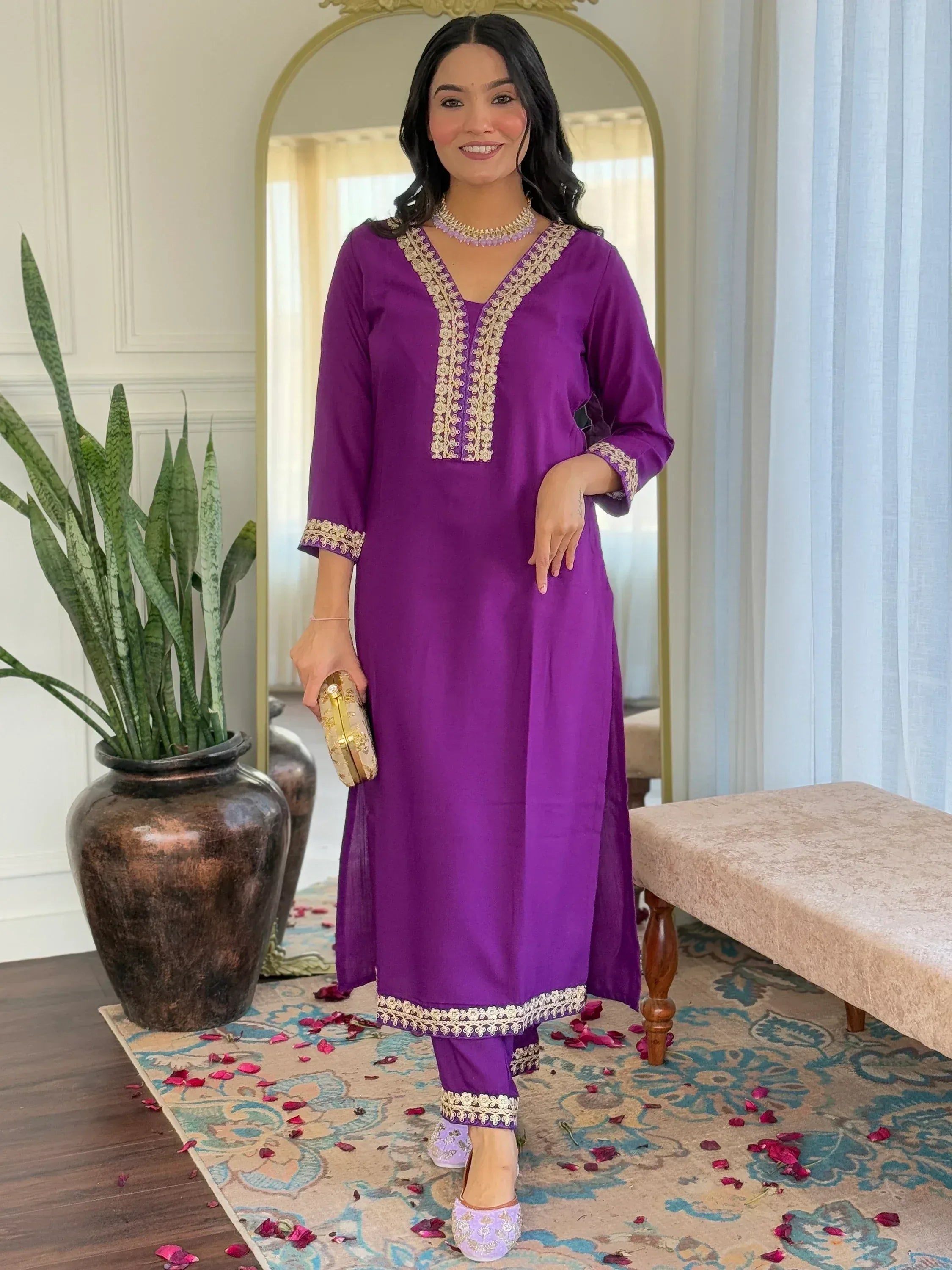 Purple embroidered kurta set with gold detailing, perfect for ethnic occasions