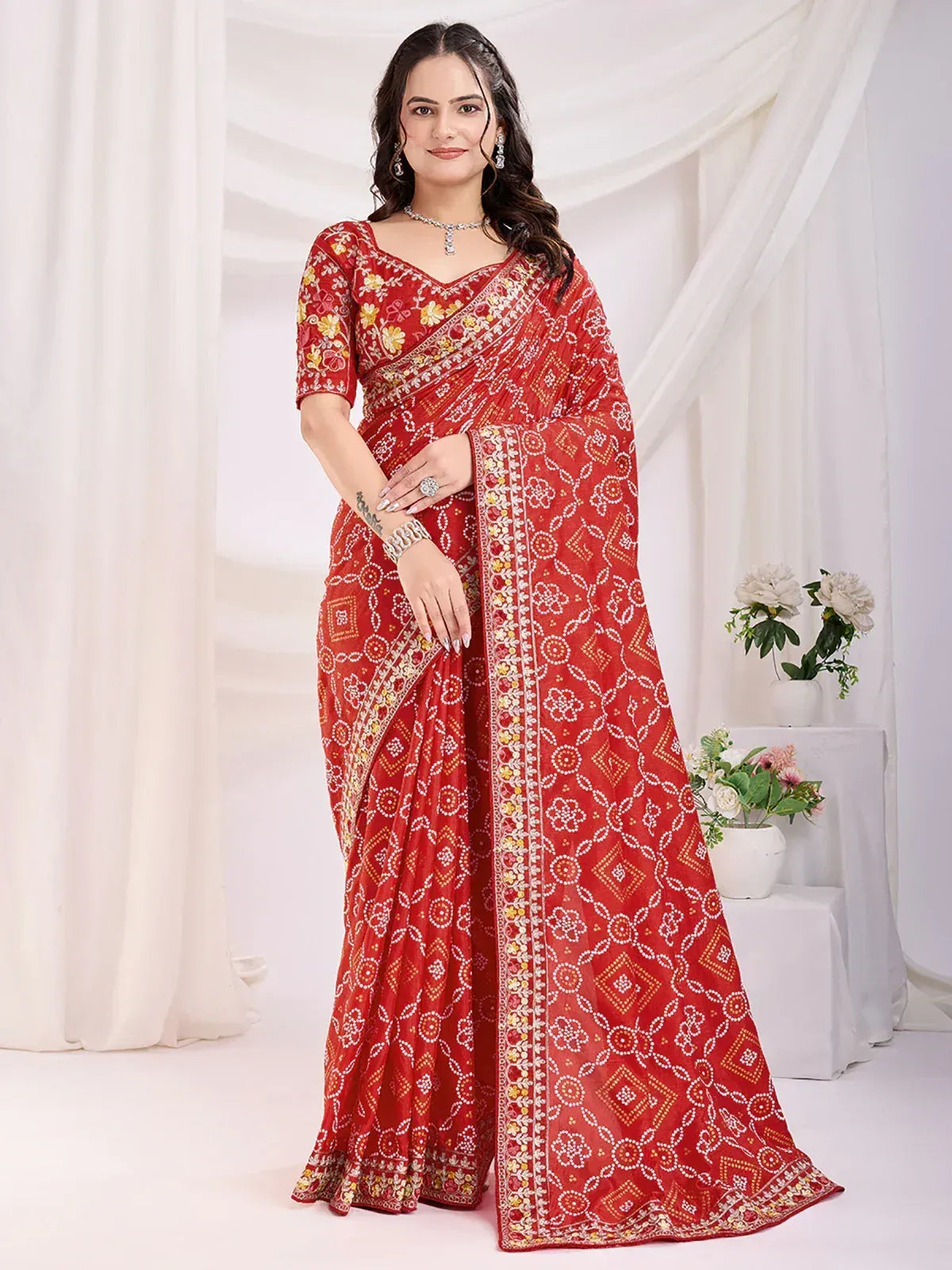 Red printed saree with floral and geometric patterns, perfect for ethnic occasions
