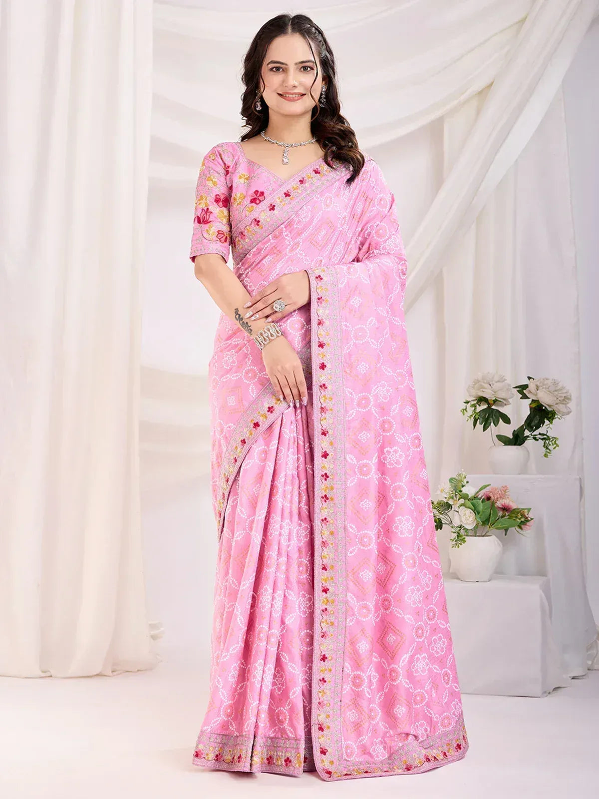 Pink floral printed saree with embroidered border, perfect for Indian ethnic occasions