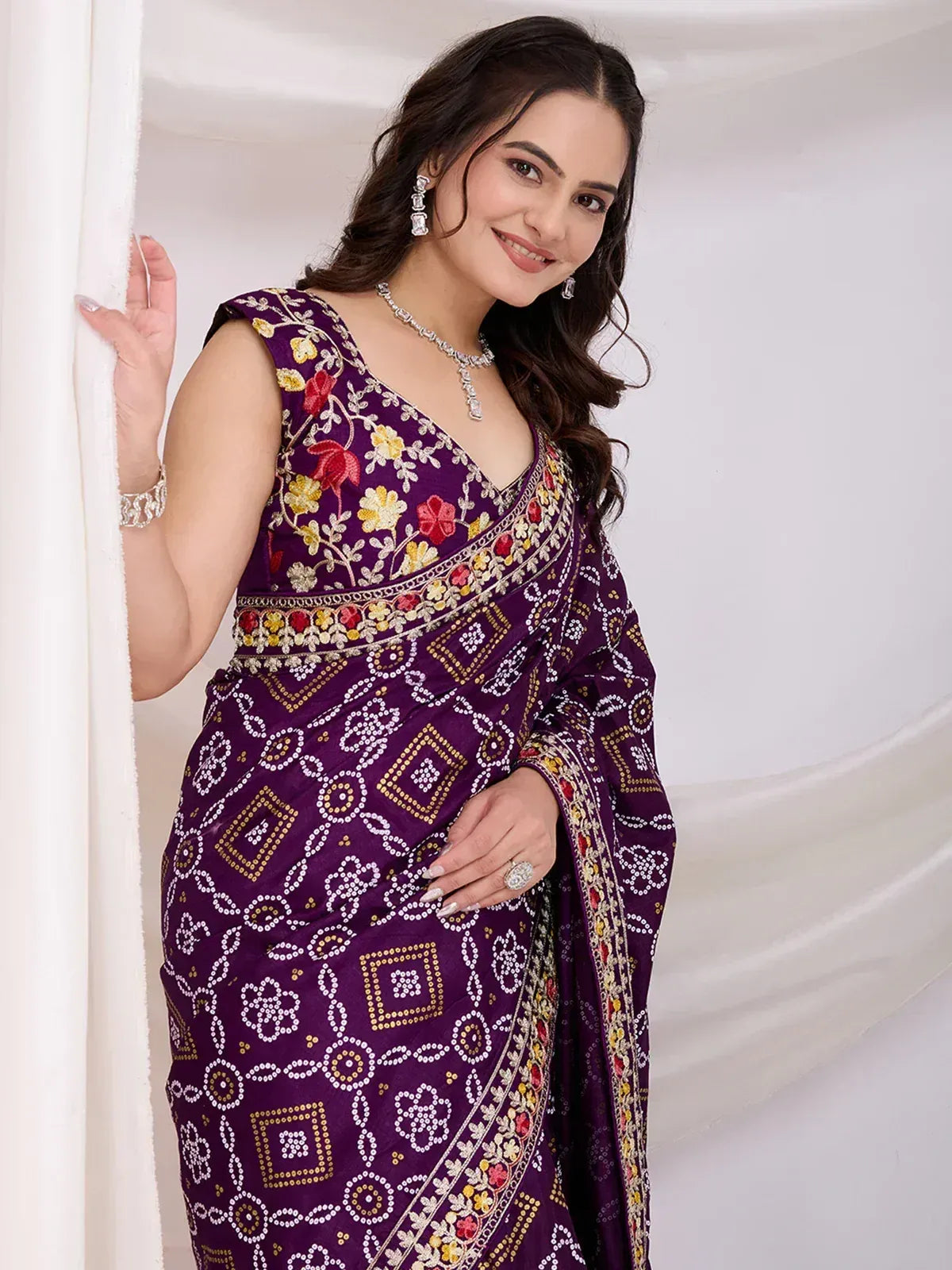 Purple embroidered saree with floral and geometric patterns, perfect for Indian ethnic wear occasions