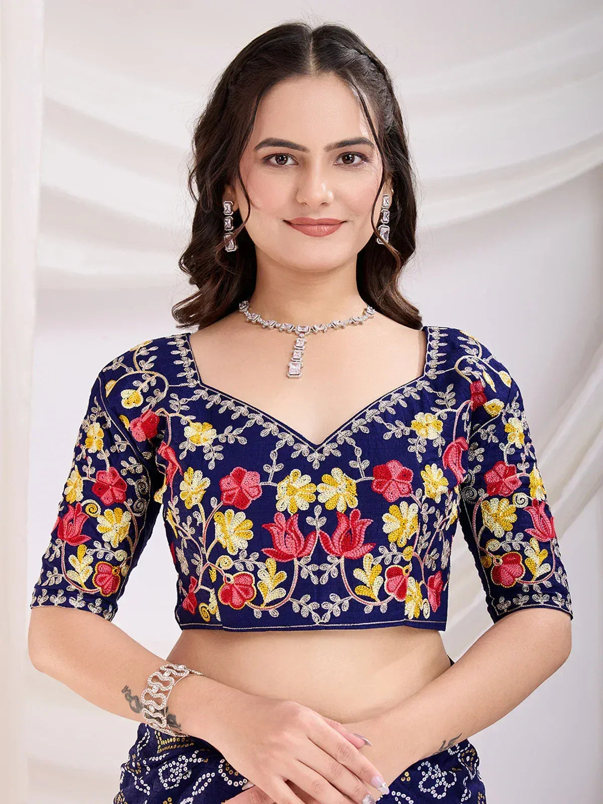 Navy blue embroidered crop top with red and yellow floral design, perfect for ethnic wear
