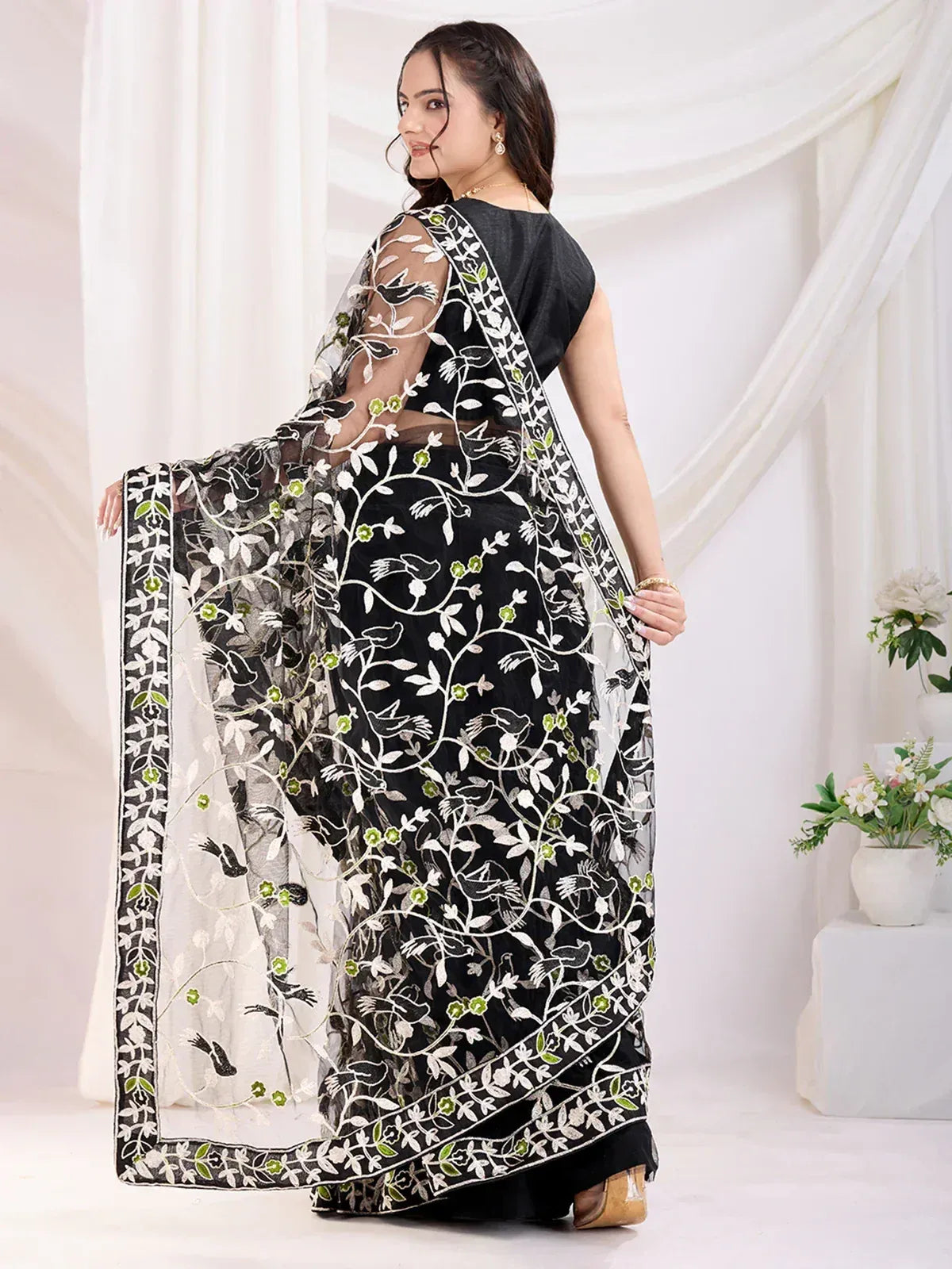 Black saree with white and green floral embroidery, sheer blouse, ethnic wear