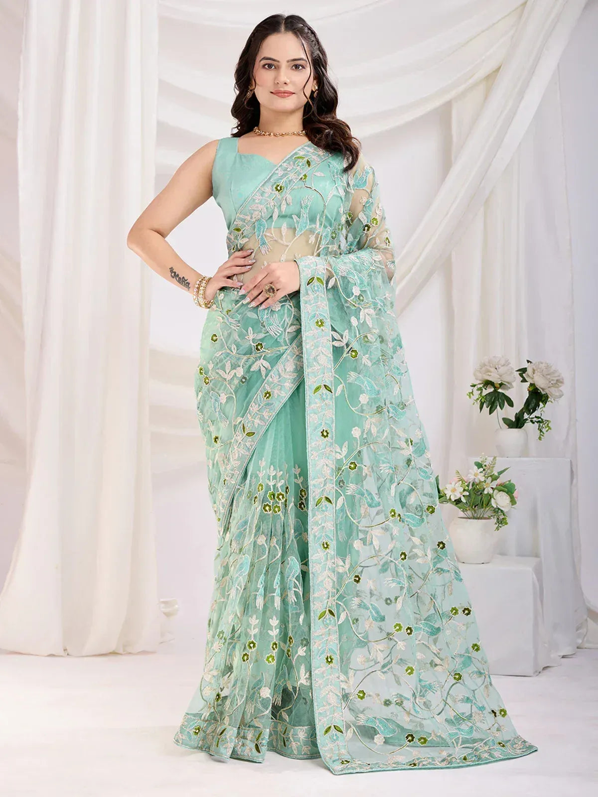 Mint green embroidered saree with floral design, perfect for Indian ethnic occasions