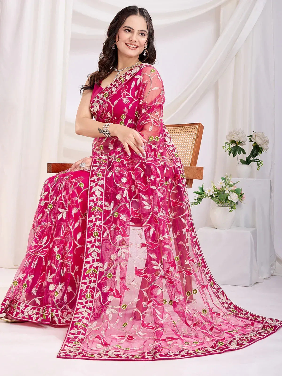 Pink embroidered ethnic gown with floral design, perfect for Indian occasions and weddings