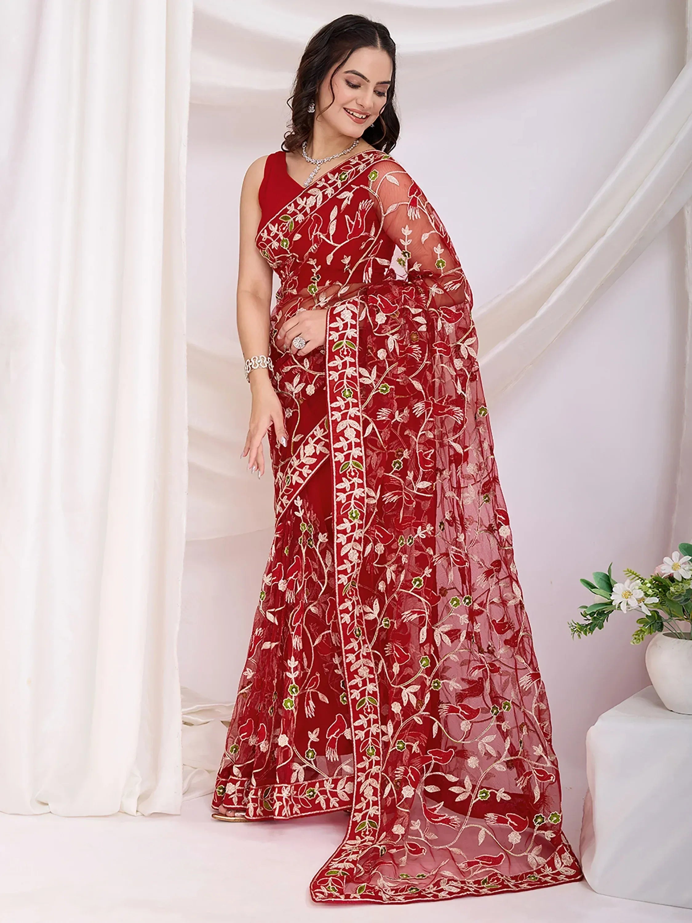 Red embroidered saree with floral and bird motifs, perfect for Indian ethnic occasions