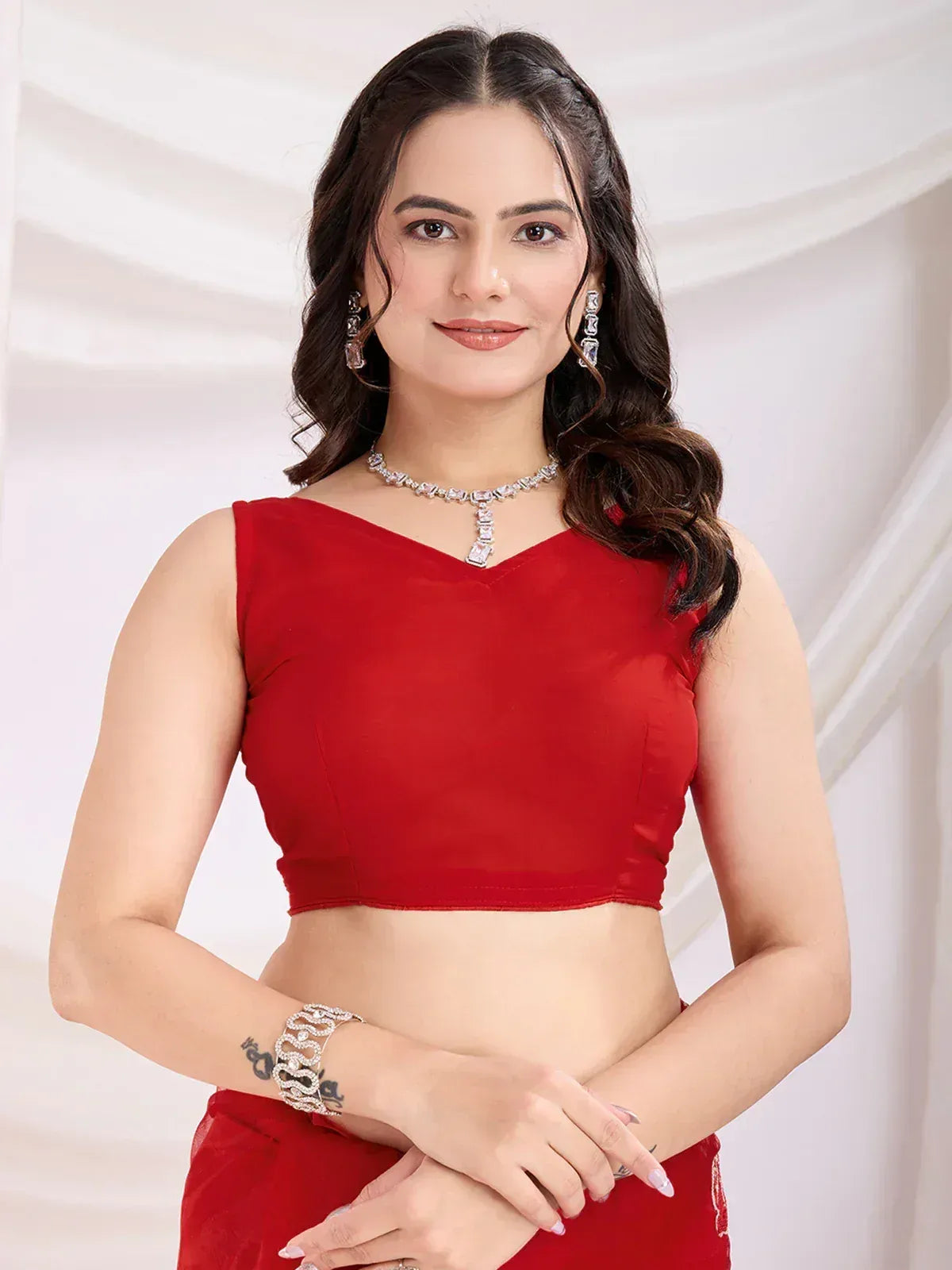 Red velvet crop top with V-neck, paired with matching skirt, ideal for Indian ethnic wear and festive occasions.