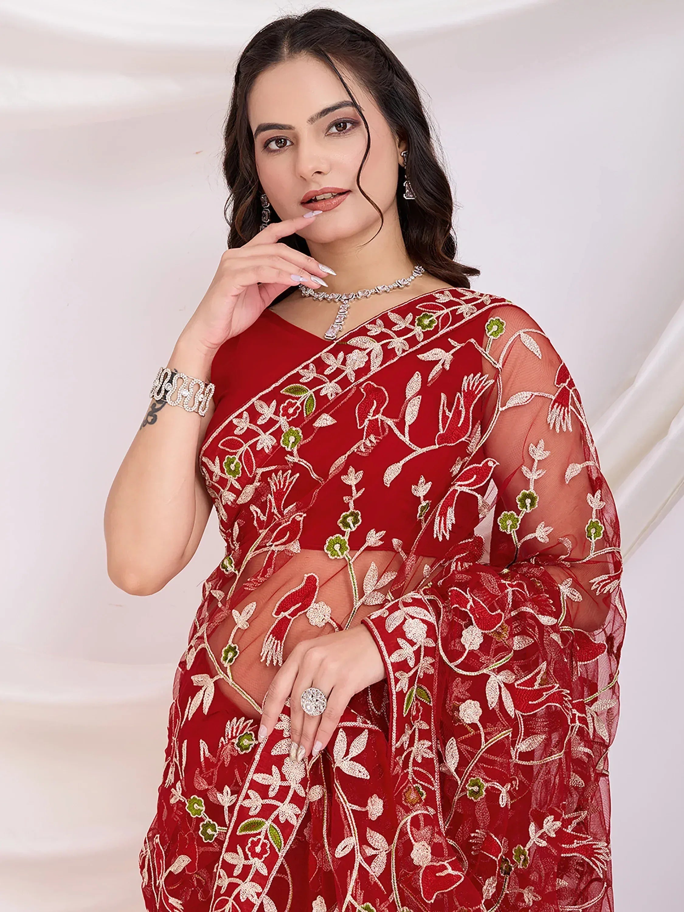Red embroidered saree with floral and bird motifs, sheer sleeves, perfect for Indian ethnic occasions